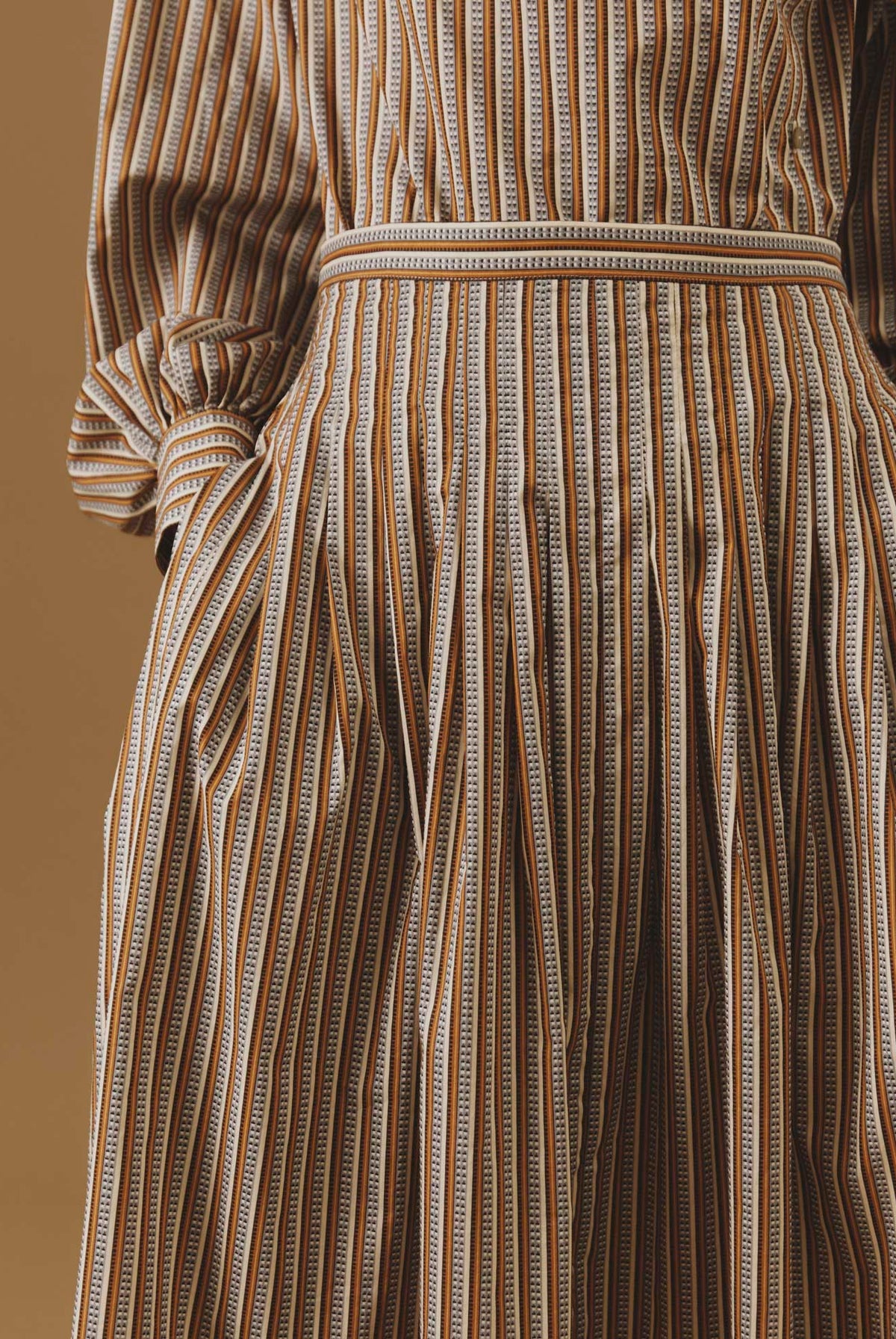 Close-up of Zazou copper striped Cotton Skirt by Thierry Colson