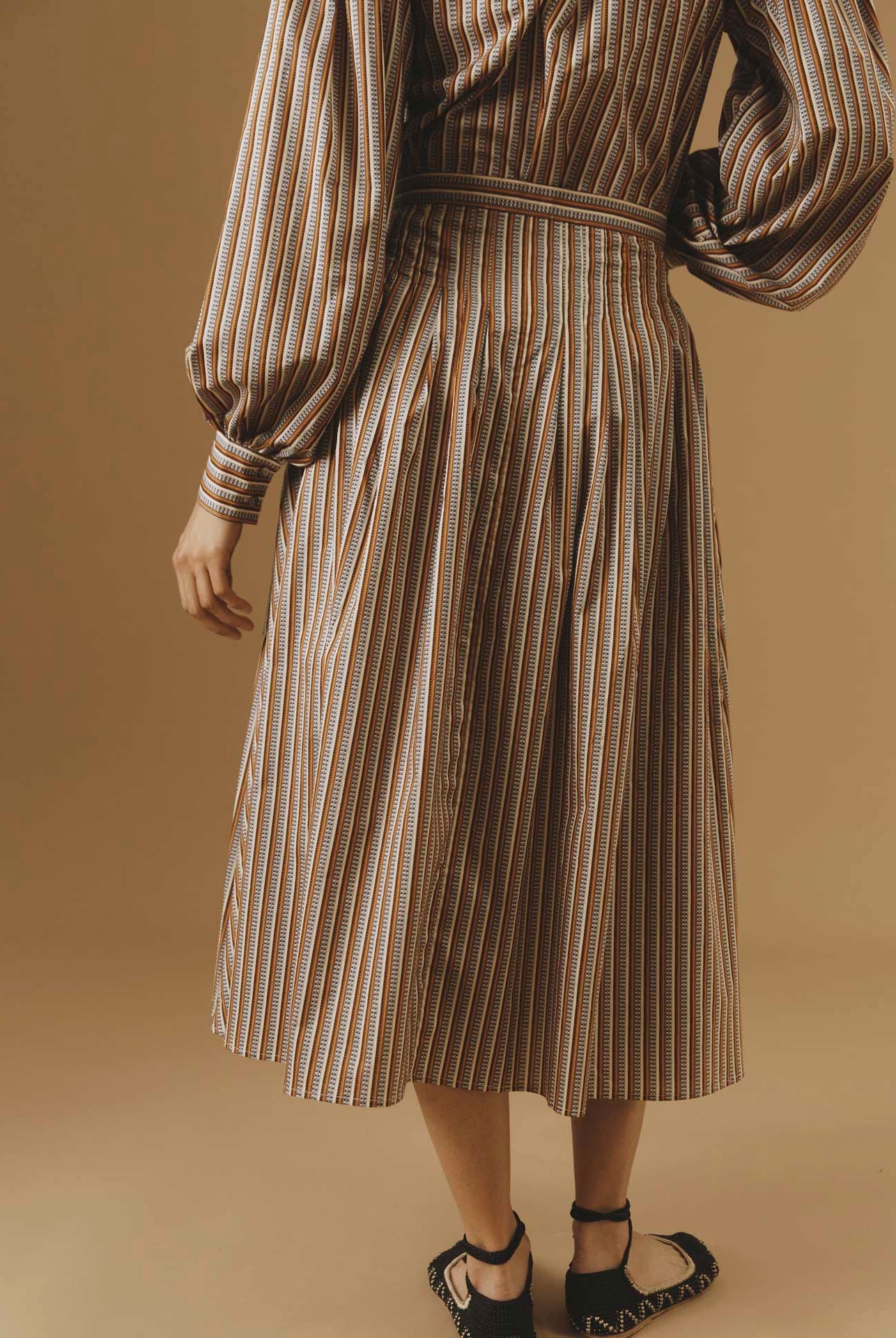 Back view of Zazou copper Cotton Skirt by Thierry Colson