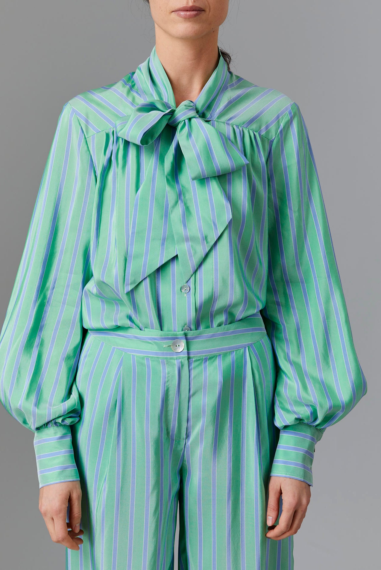 Front view of Alba Blouse with tied collar - Silk Road Stripes - Green / Blue by Thierry Colson