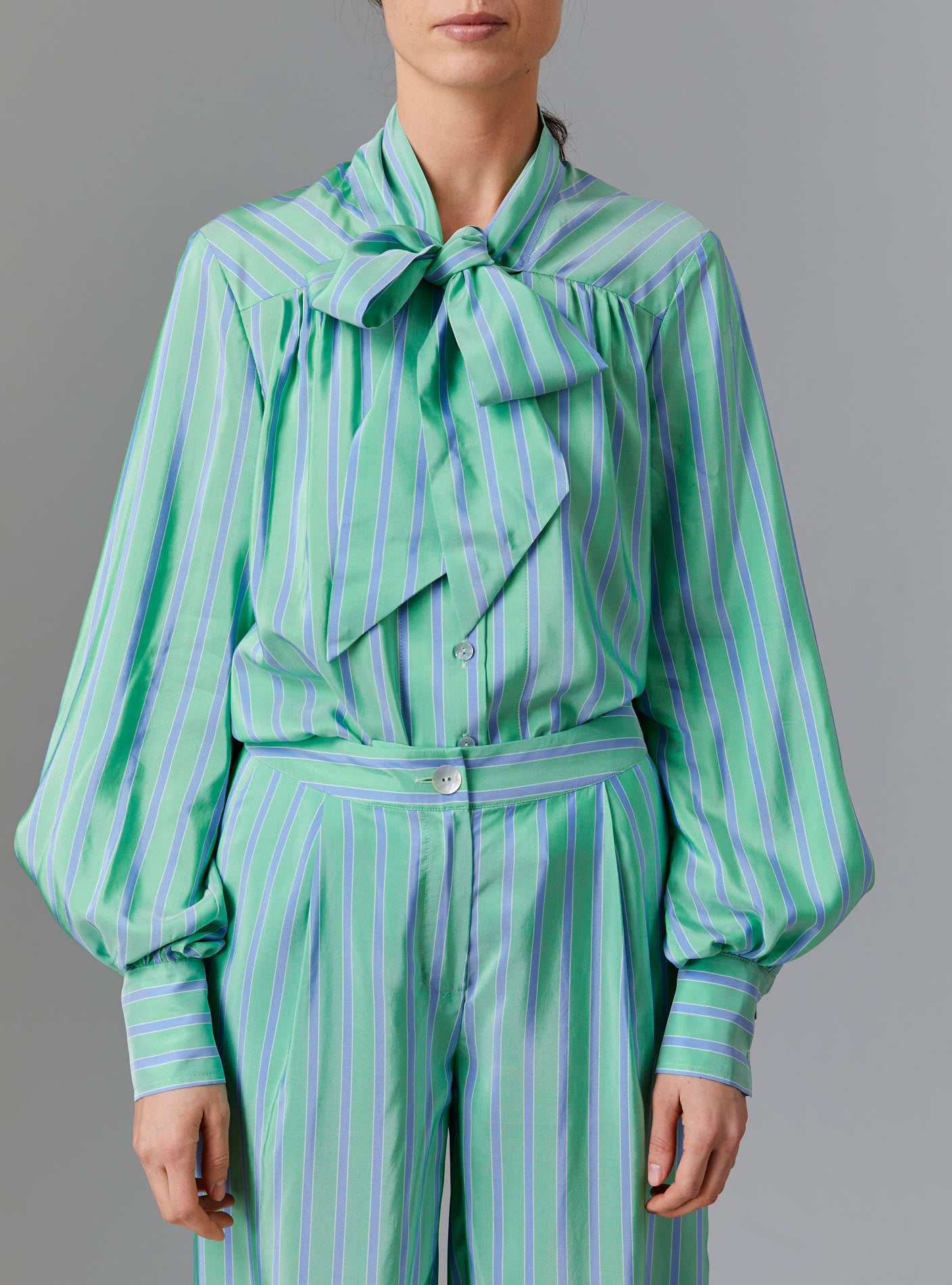 Front view of Alba Blouse with tied collar - Silk Road Stripes - Green / Blue by Thierry Colson