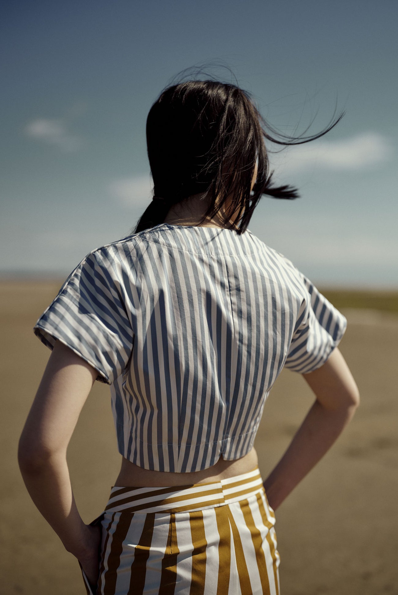 Back view - Bianca Vest in Storm Blue with large and thin stripes.