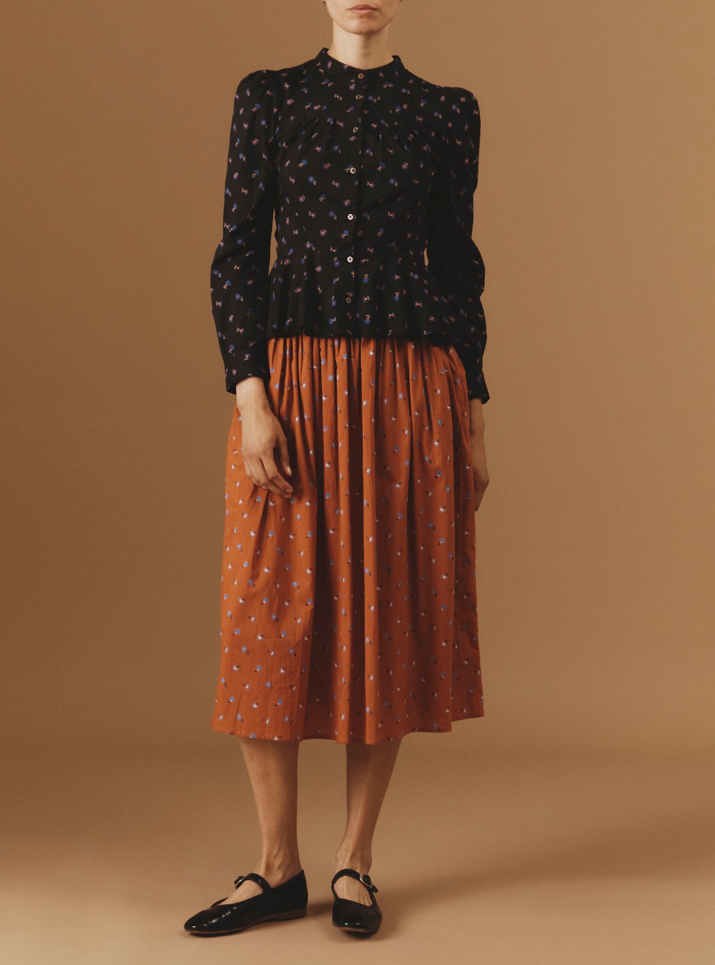 View front of Alix Black Carnation Print Blouse with Verde Orange Skirt  by Thierry Colson - Pre Spring