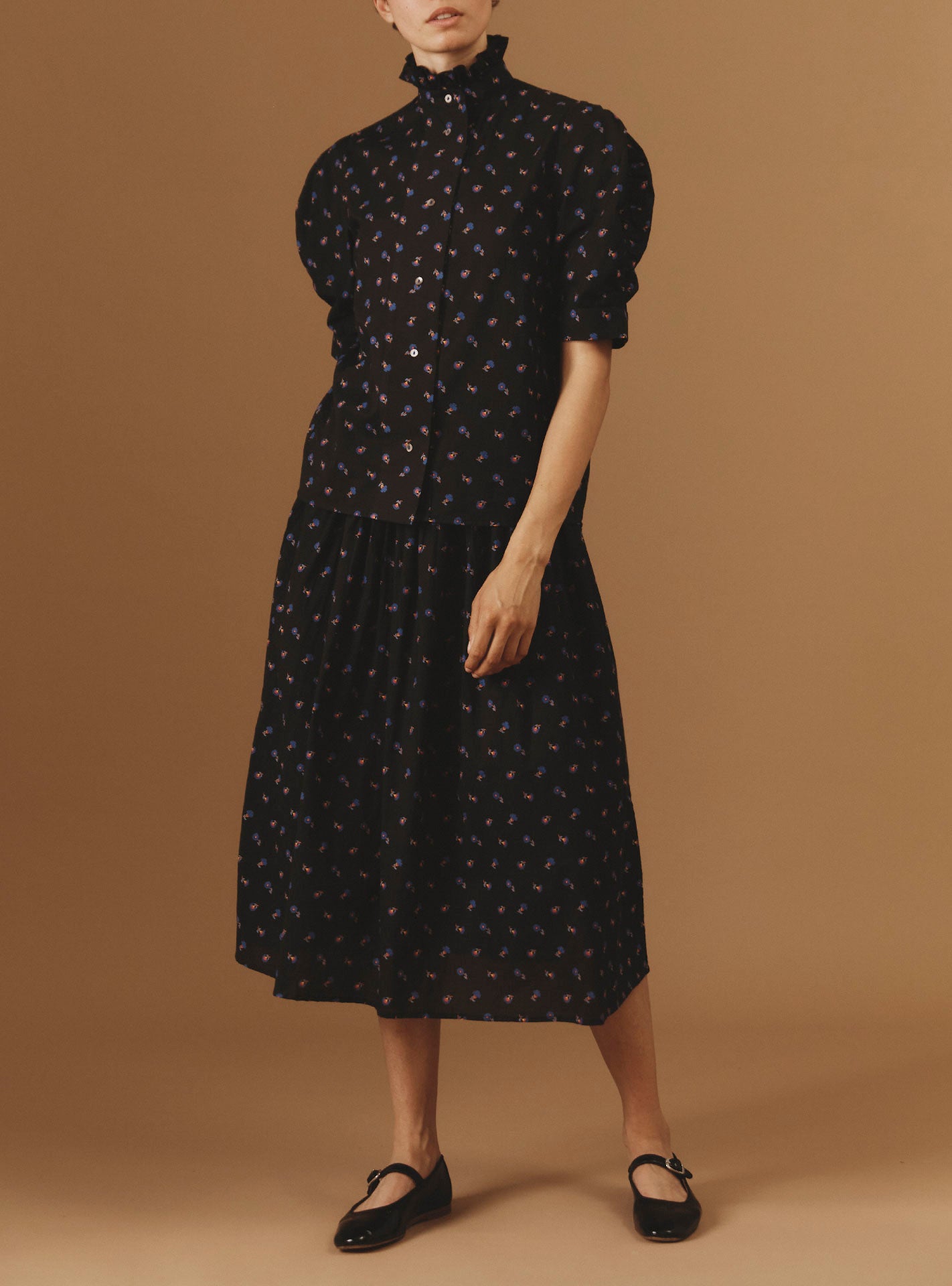 Full-length view of Vita black blouse and Verde Skirt from Pre Spring 2024 by Thierry Colson