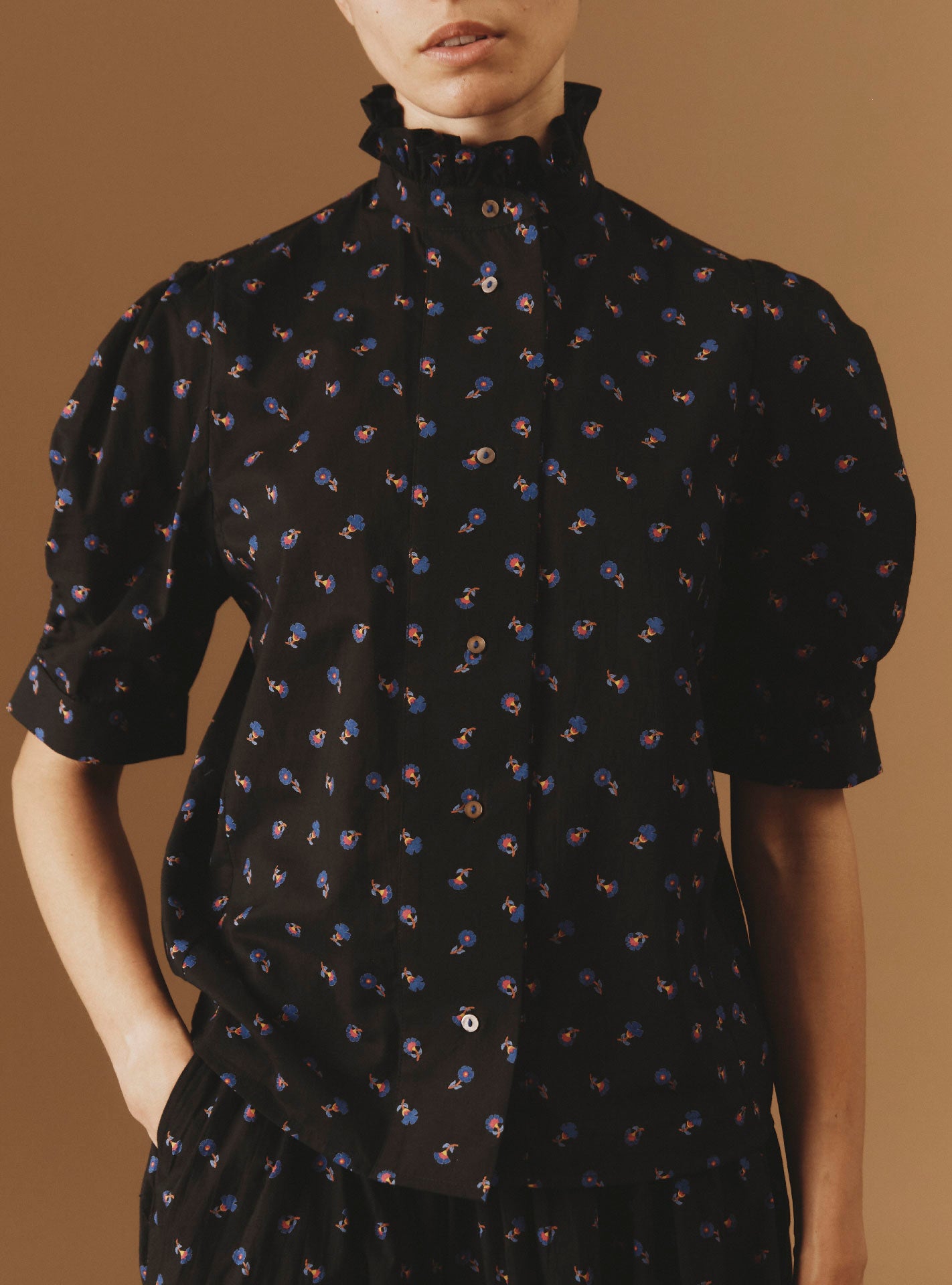 Close-up of Vita black blouse from Pre Spring 2024 by Thierry Colson