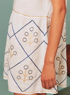 Bottom view of Allison Mini Dress: Archaic Embroidery in White by Thierry Colson