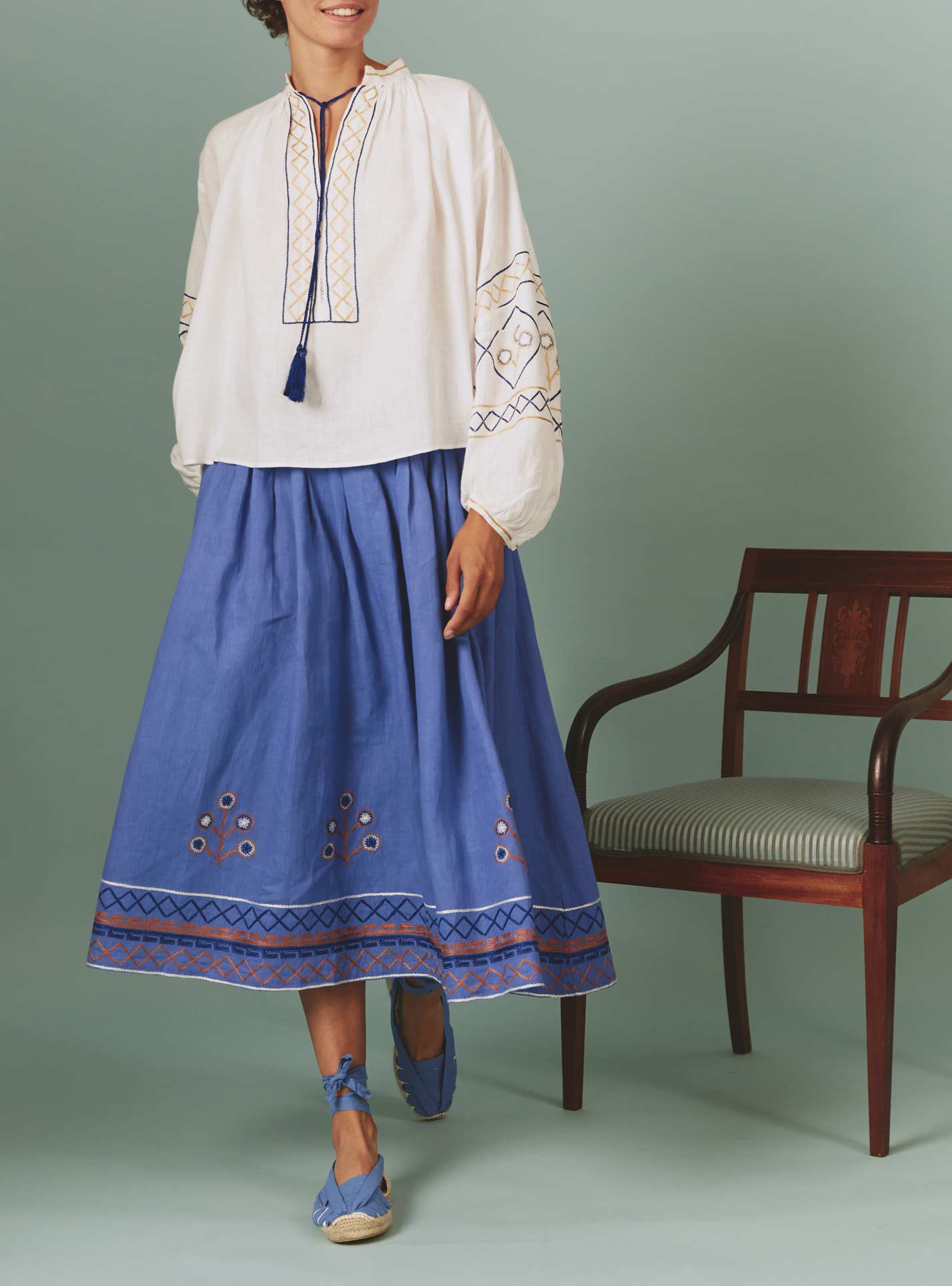 Front view Guise Blouse with Archaic Embroidery in White by Thierry Colson, with Zazou skirt in blue lavender