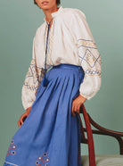 Side view of Lavender Zazou Skirt with White Guise Blouse: Archaic Embroidery by Thierry Colson