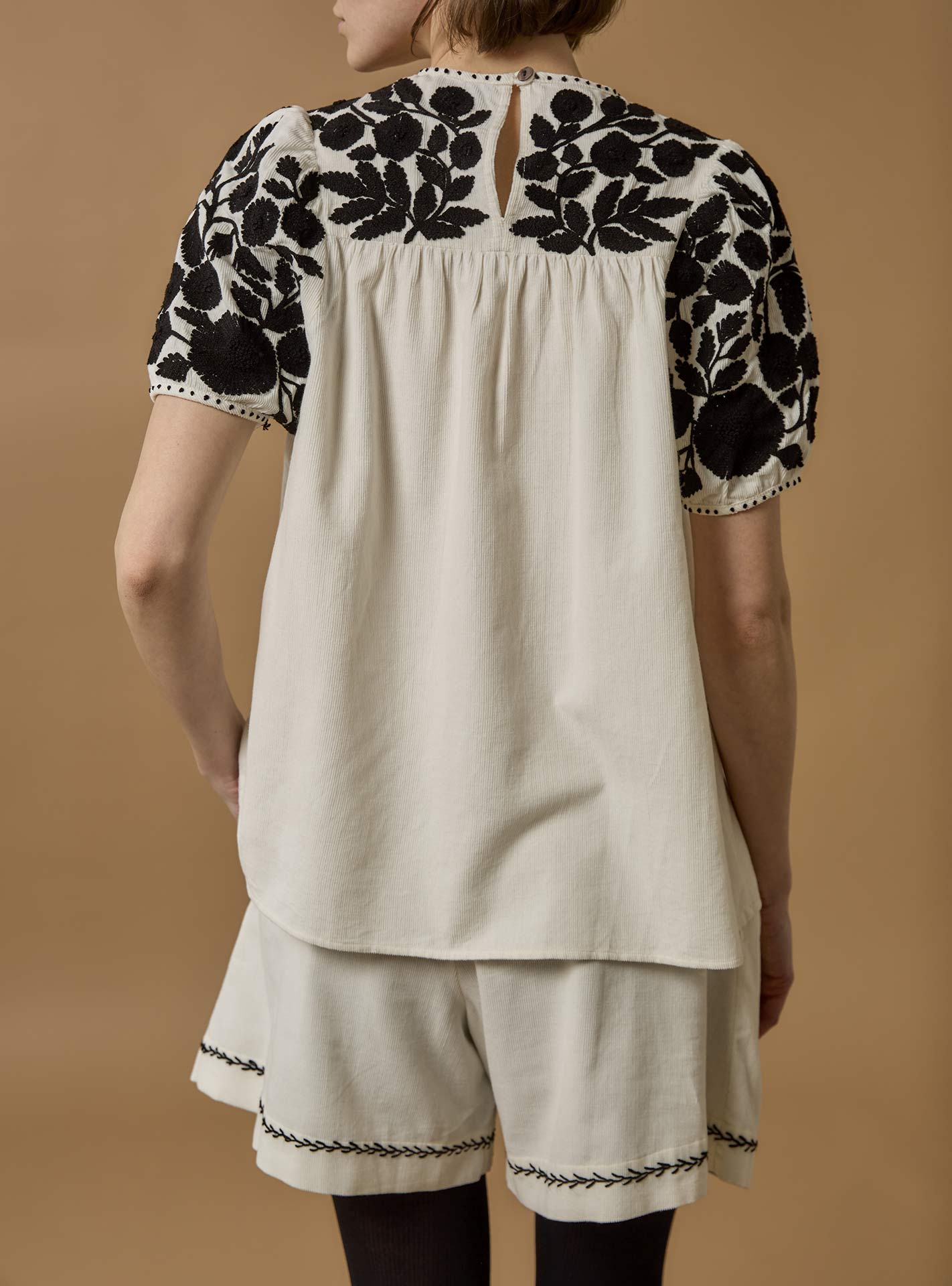 Back view of Olympia Embroidered Corduroy Cream/Black Top with Kenya Shorts by Thierry Colson
