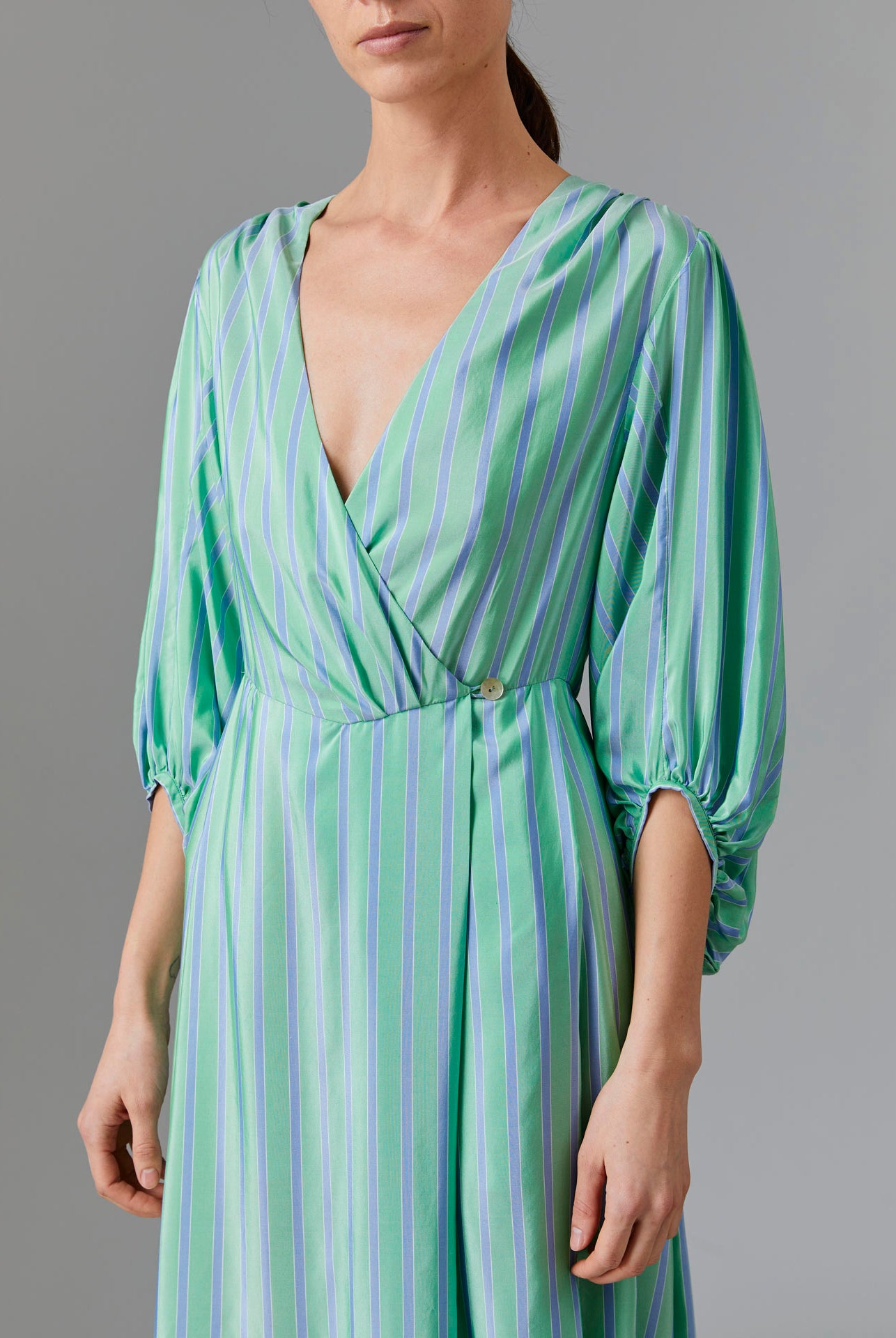 Close up front view of Phoebe Long Dress - Silk Road Stripes in Green/Blue | Thierry Colson Fall 2024 Collection