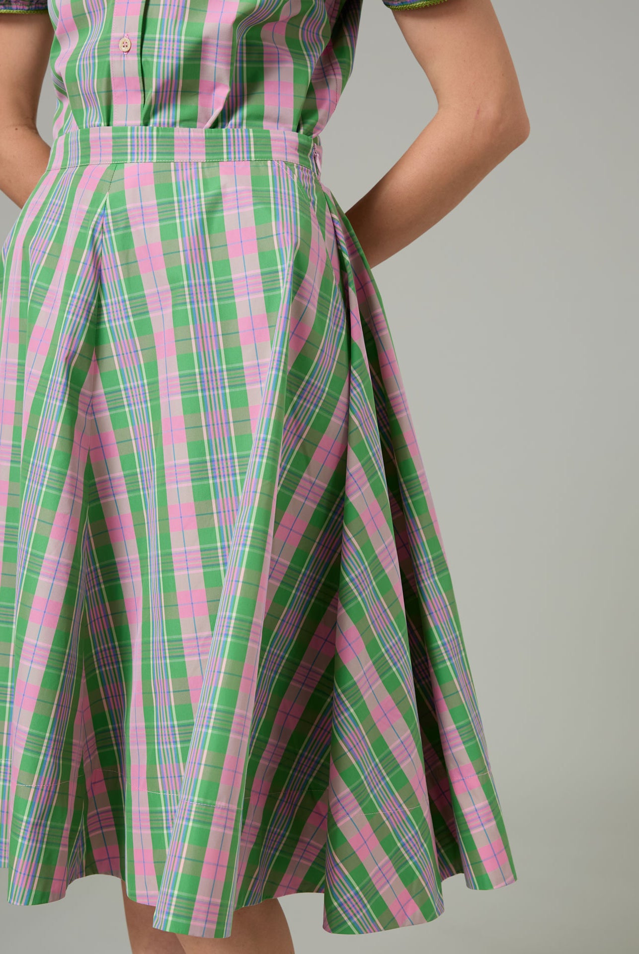 Green and pink plaid Ikat Skirt on a plain background