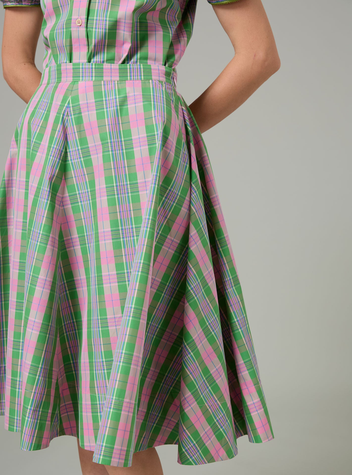 Green and pink plaid Ikat Skirt on a plain background