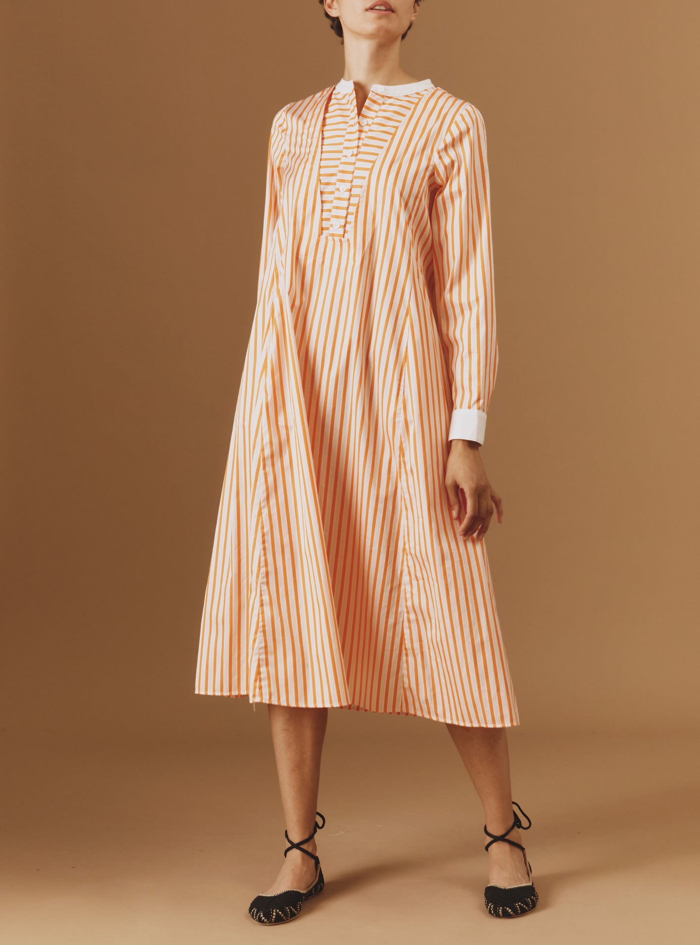 Front view of Victoria Midi stripes Orange/Salmon/White kaftan by Thierry Colson