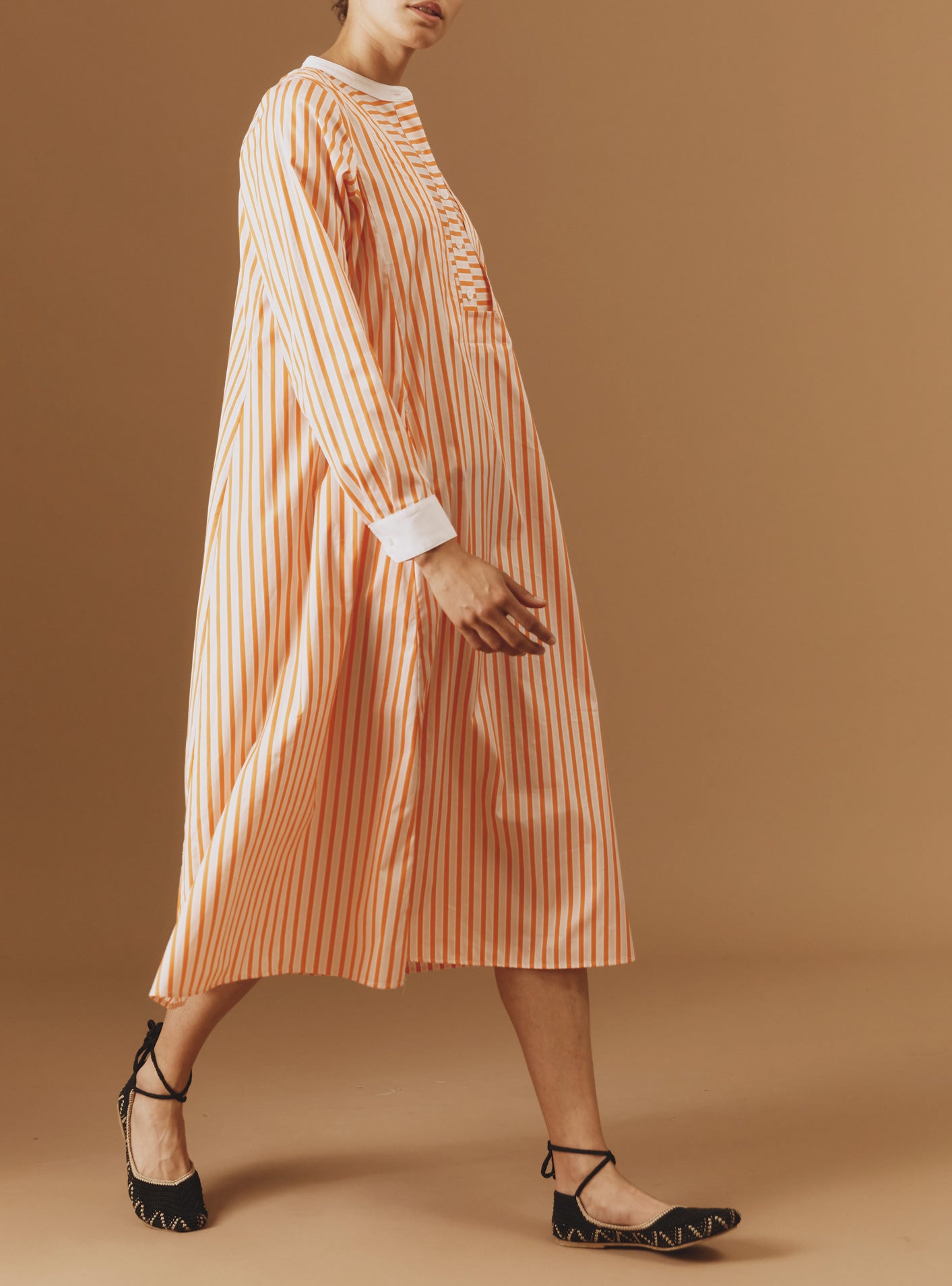 Side view of Victoria Midi stripes Orange/Salmon/White kaftan by Thierry Colson