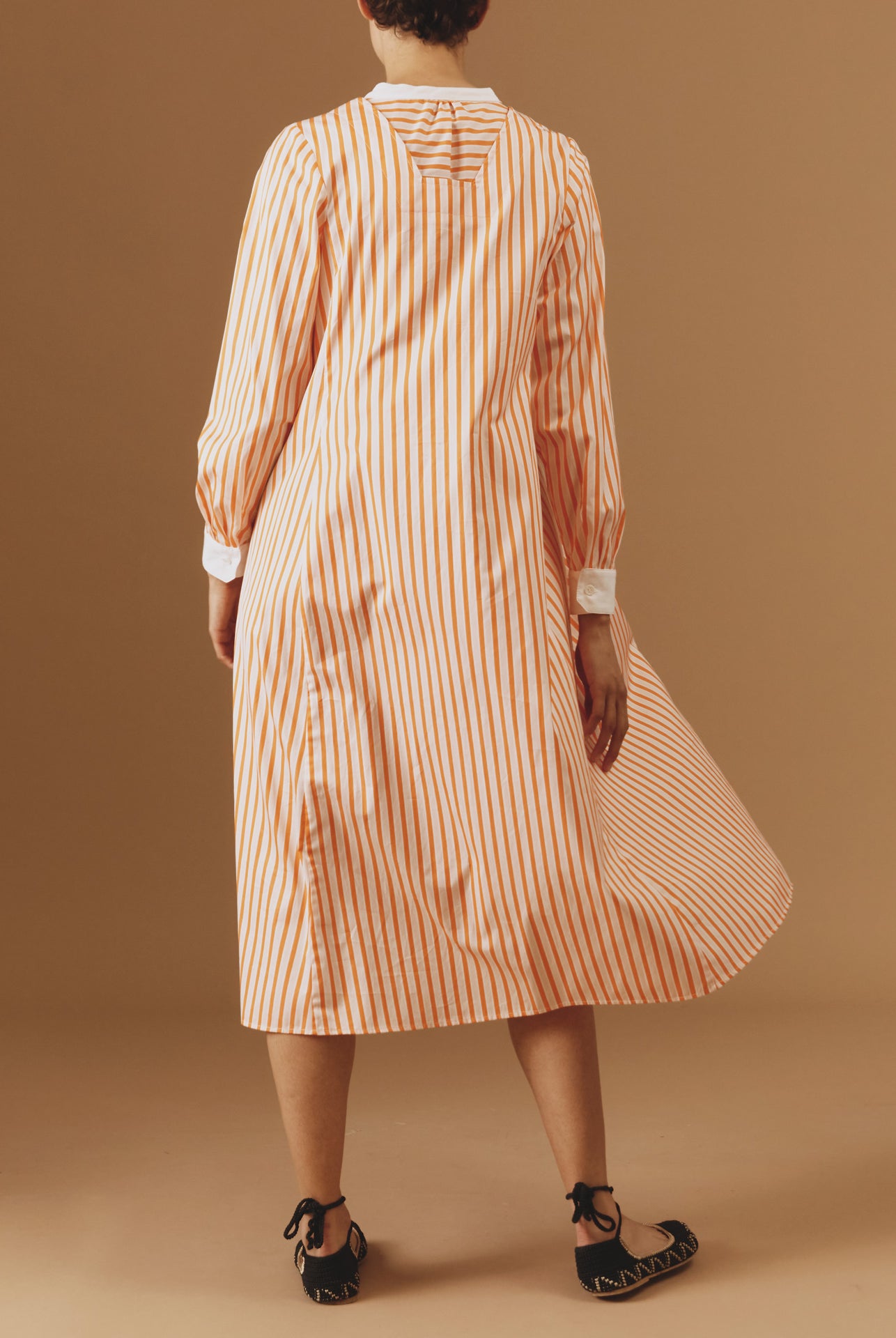 Back view of Victoria Midi stripes Orange/Salmon/White kaftan by Thierry Colson