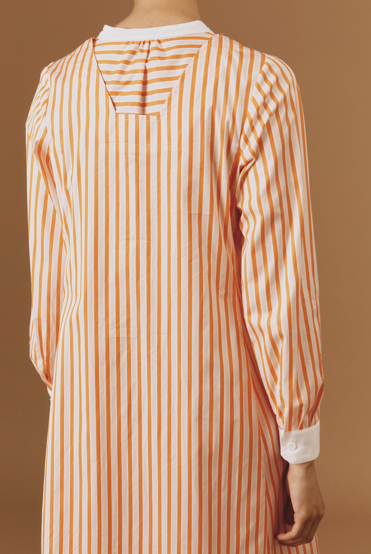 Close up back view of Victoria Midi stripes Orange/Salmon/White kaftan by Thierry Colson