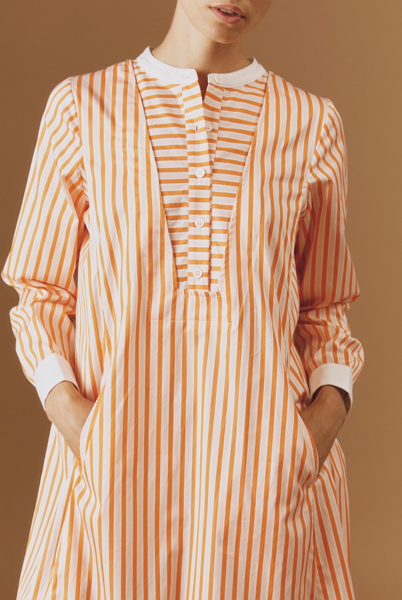 Close up Front view of Victoria Midi stripes Orange/Salmon/White kaftan by Thierry Colson