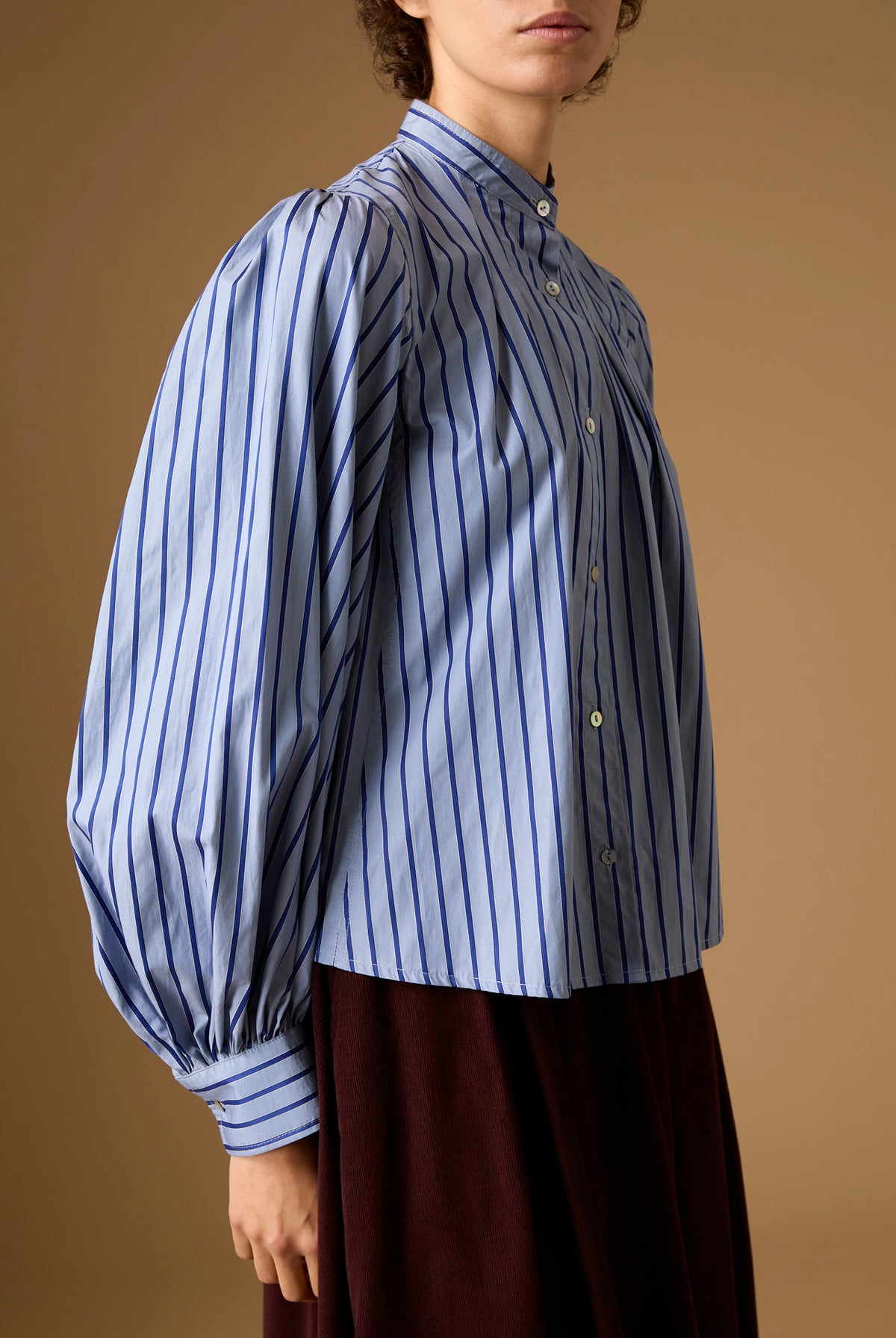 Side detail of Yana county Grey Blue Stripes Blouse with Wynona Chocolate Corduroy skirt by Thierry Colson