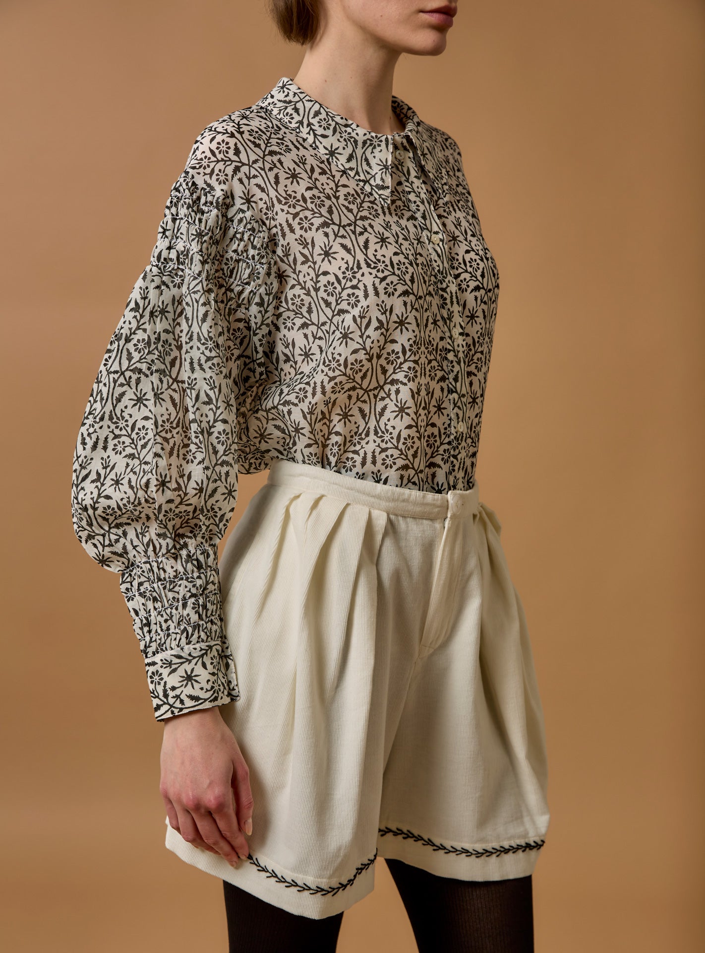 Side view of Zlata Black Blouse - Paper Cut Print by Thierry Colson