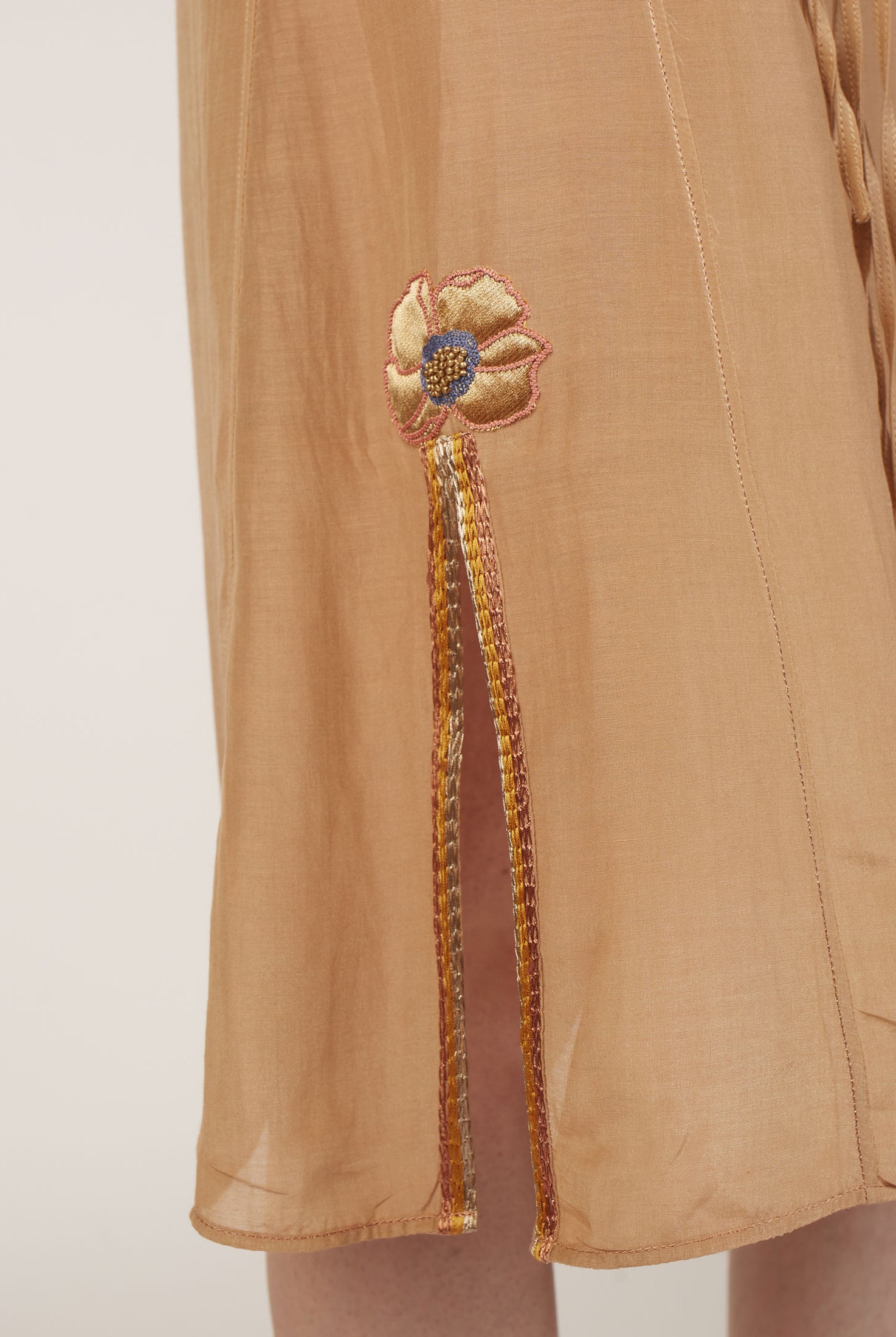 Bottom detail of Betty Sand Rose Long Dress by Thierry Colson