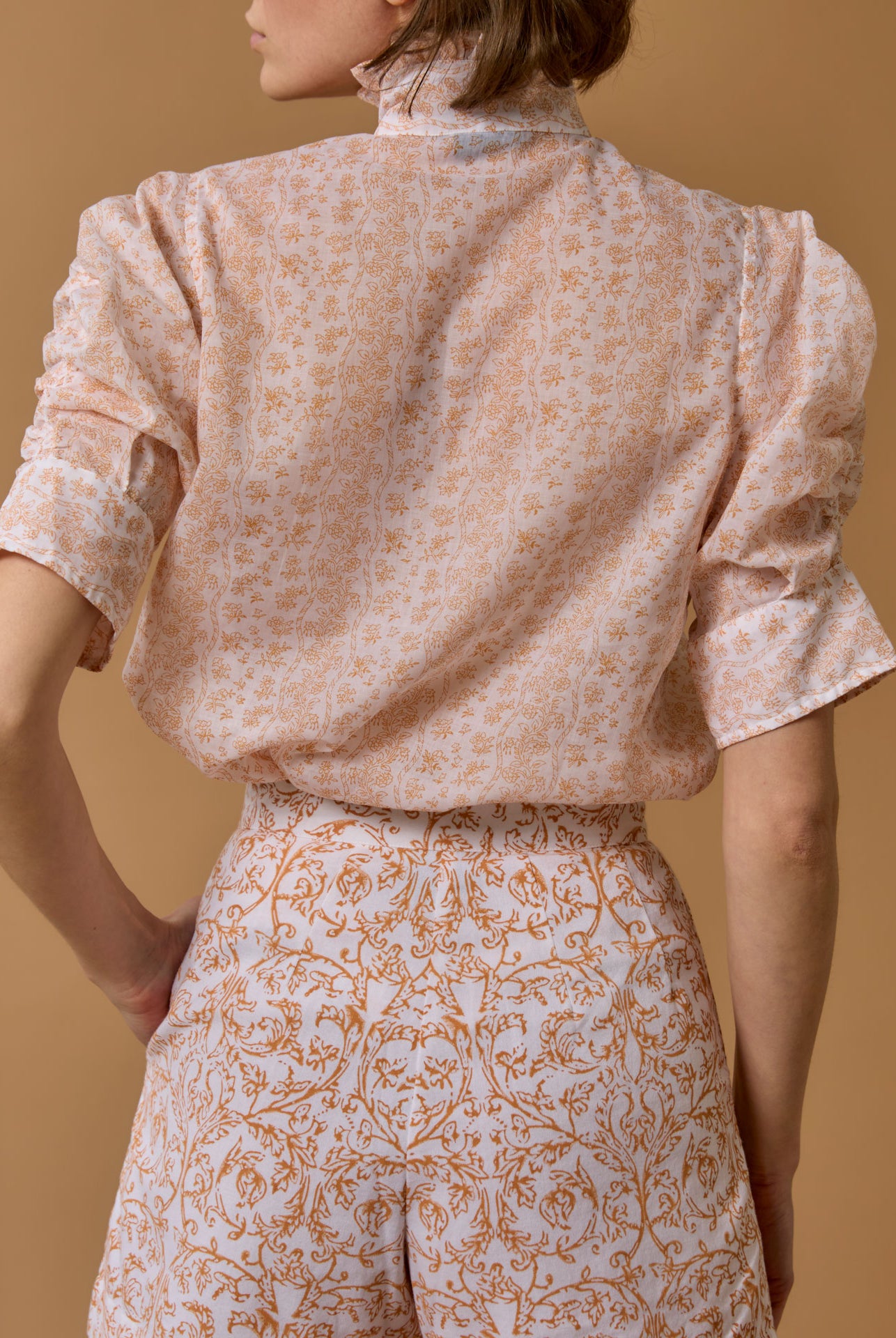 Back view of Vita Evora Print Brandy Blouse by Thierry Colson