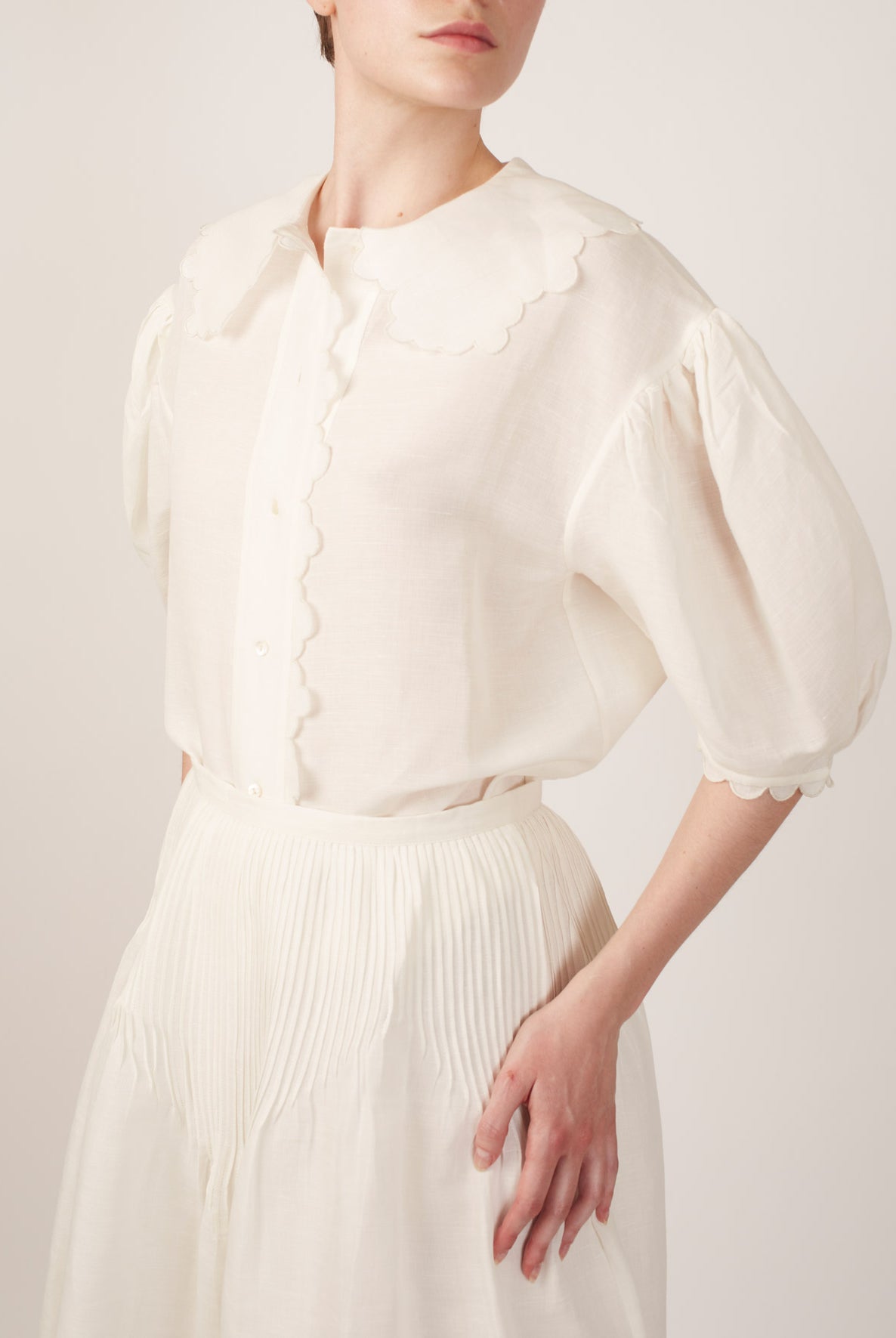 Side view of Vanina Barocco Scallops Off White Blouse by Thierry Colson