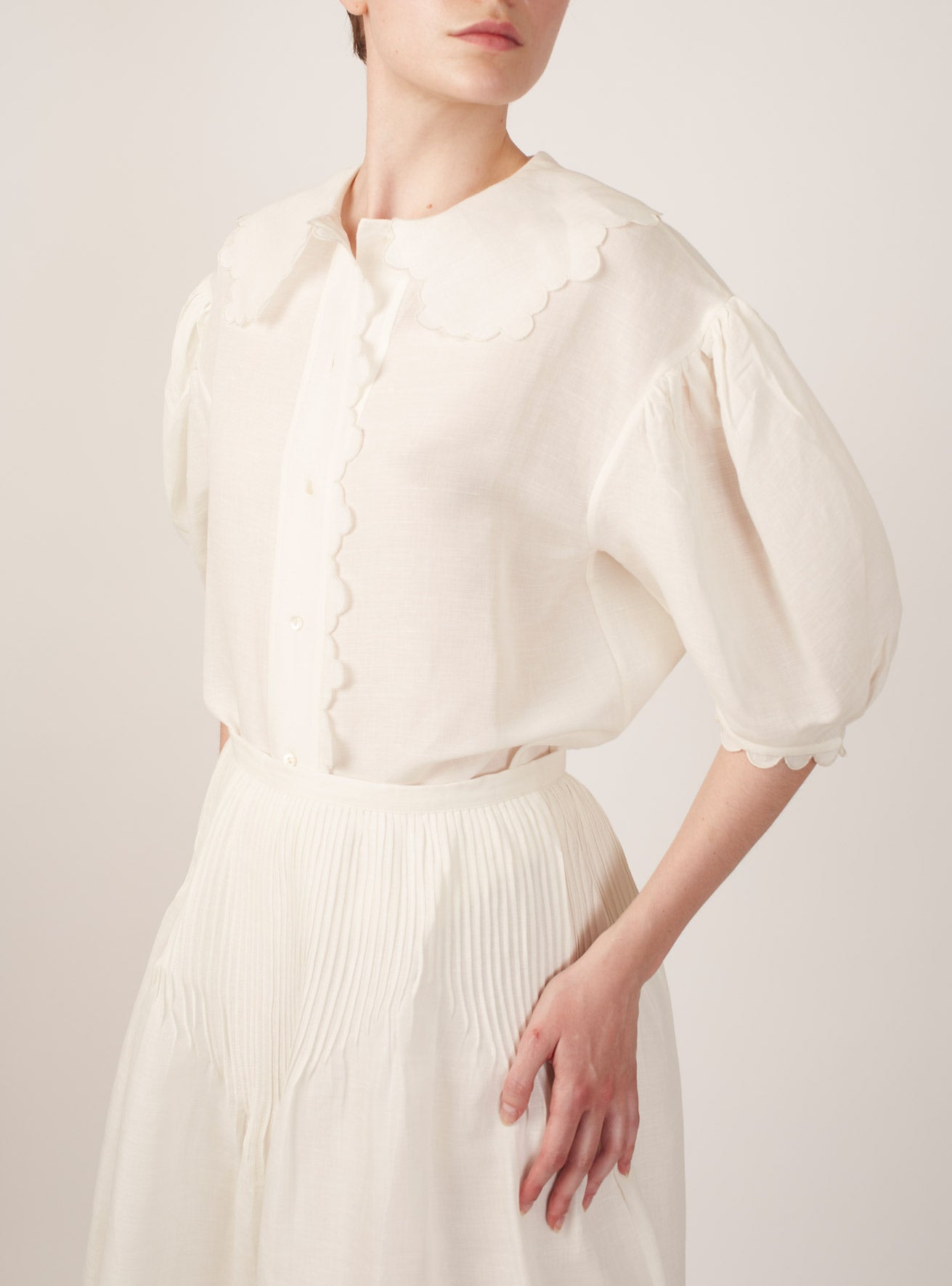 Side view of Vanina Barocco Scallops Off White Blouse by Thierry Colson