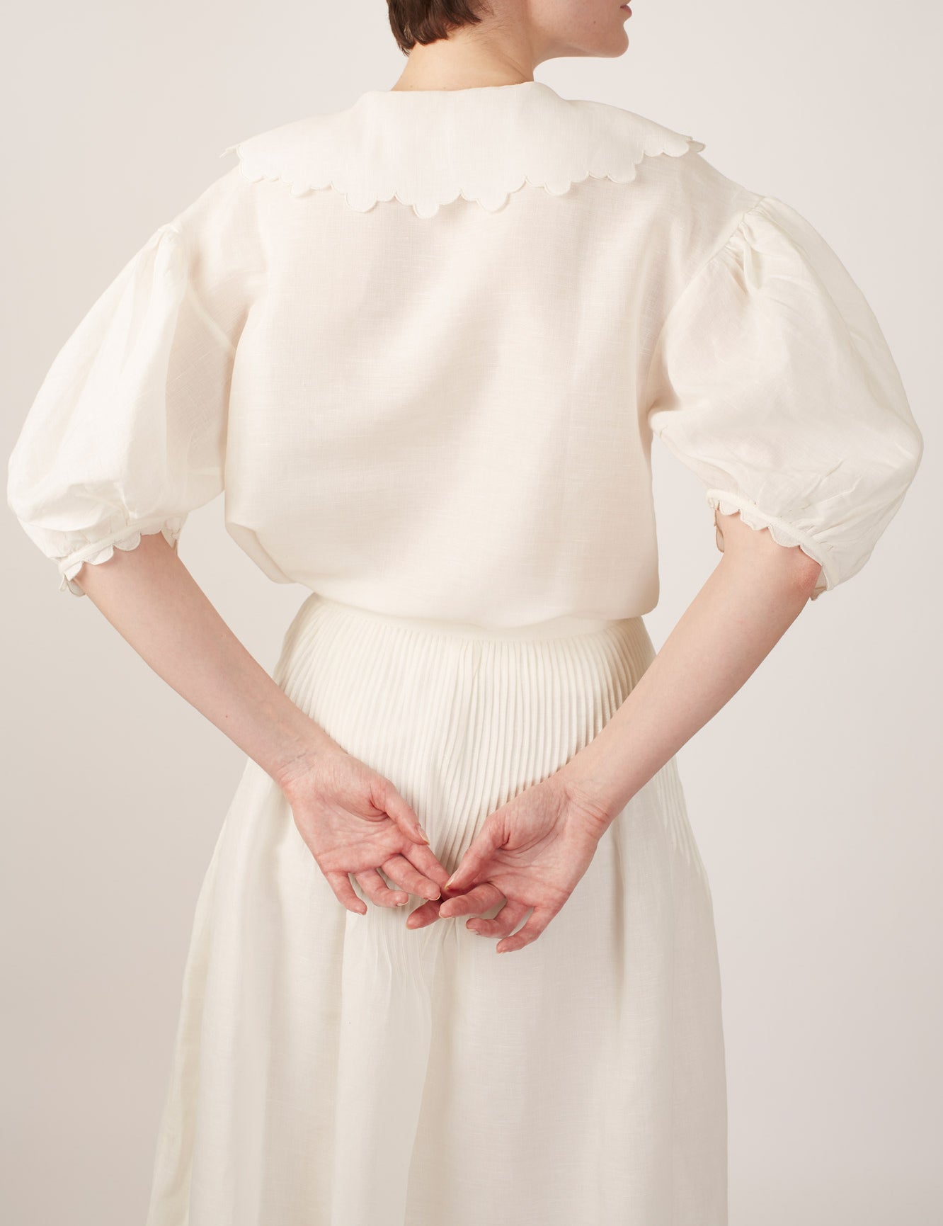 Back view of Vanina Barocco Scallops Off White Blouse by Thierry Colson 