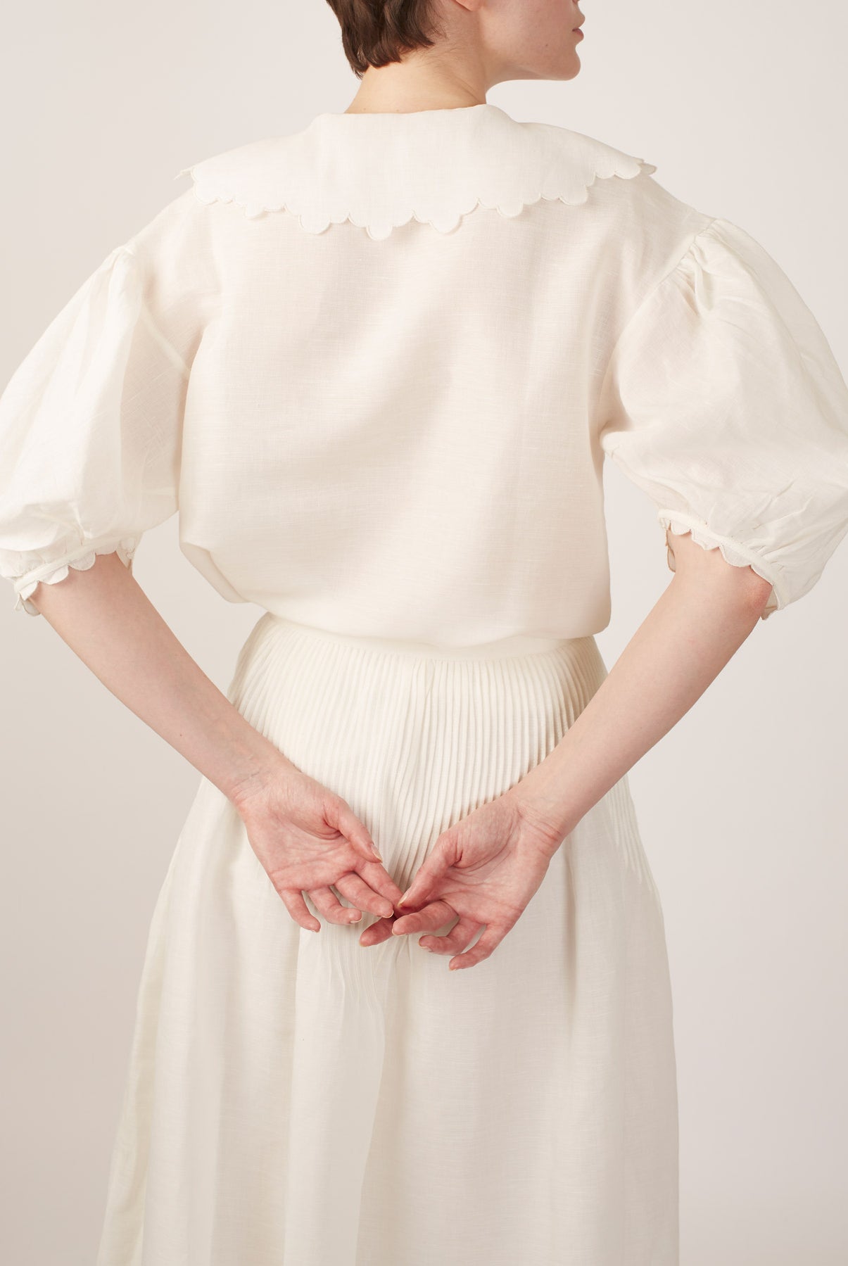Back view of Vanina Barocco Scallops Off White Blouse by Thierry Colson