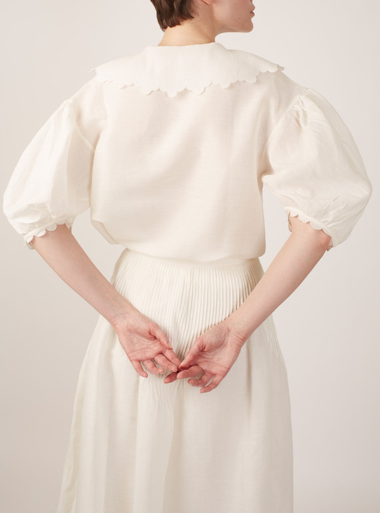 Back view of Vanina Barocco Scallops Off White Blouse by Thierry Colson
