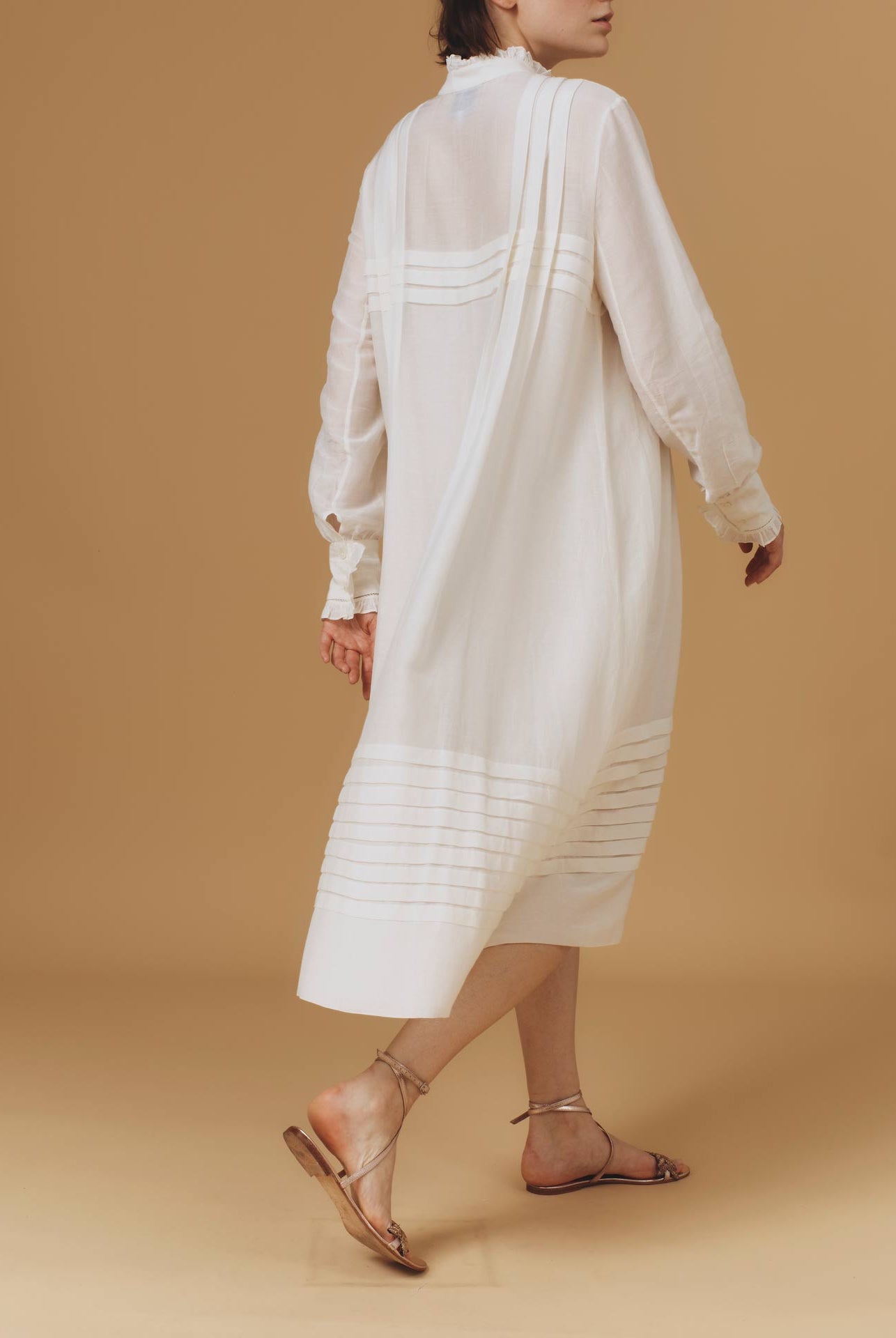 Back of Zita Optical Pleats Off White dress by Thierry Colson