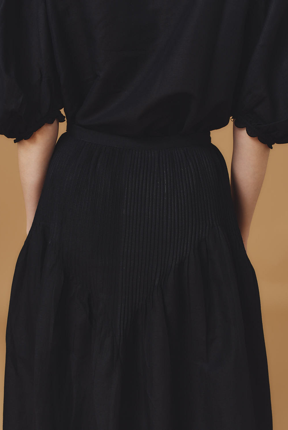 Detail back view of Verde Barocco Scallops Black Skirt by Thierry Colson
