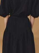 Detail back view of Verde Barocco Scallops Black Skirt by Thierry Colson