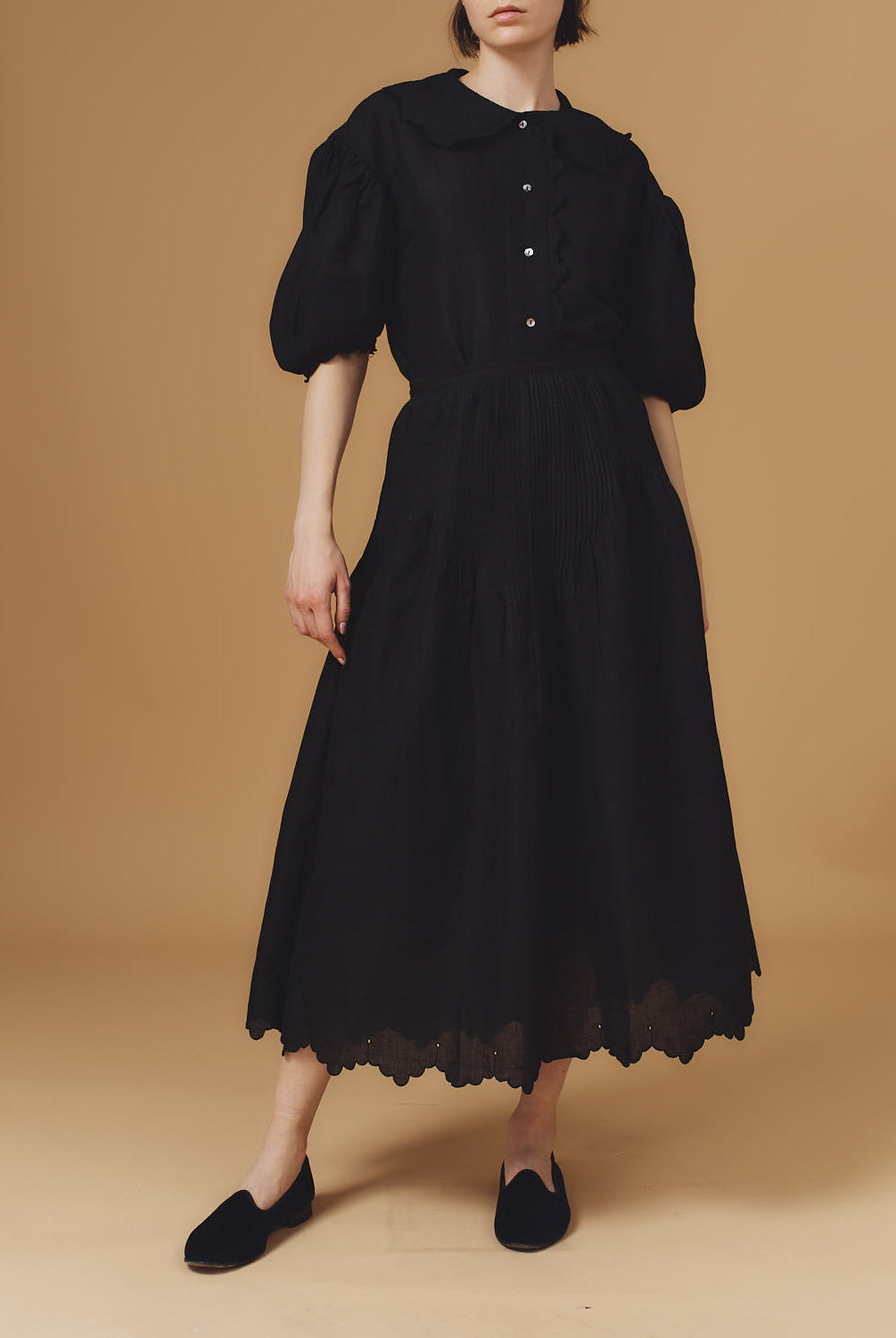 Front view of Vanina Barocco Scallops Black Blouse with Verde Skirt by Thierry Colson