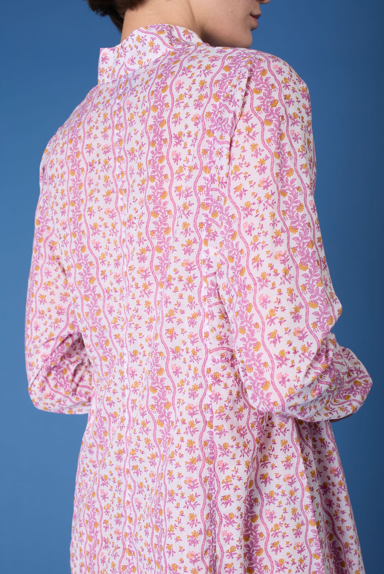 Close up back view of Parvati Cyclamen Mustard long Kaftan by Thierry Colson