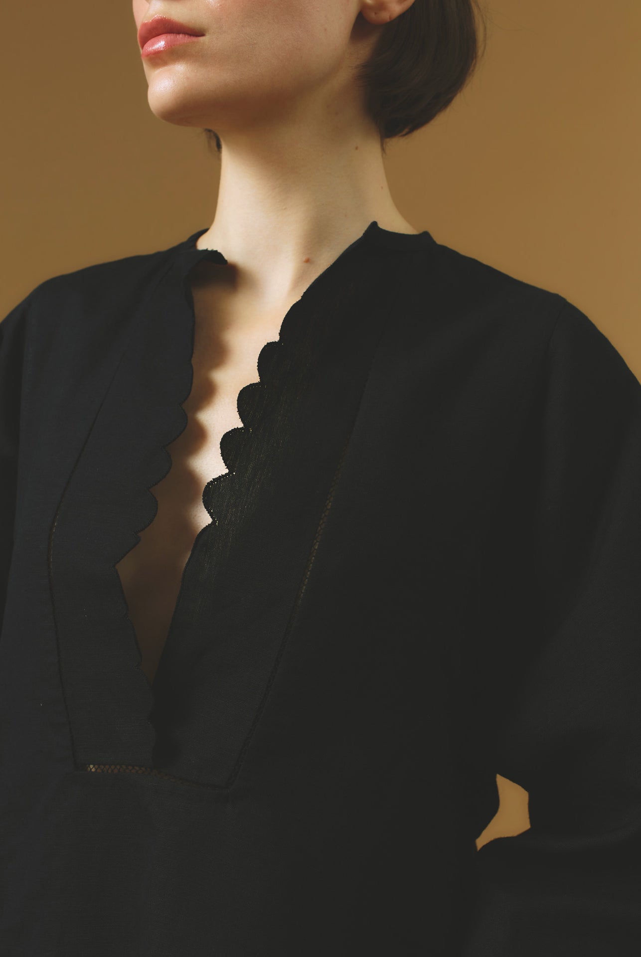 Close up collar view Rachel black mini Kaftan by Thierry Colson - Barocco Scallops theme