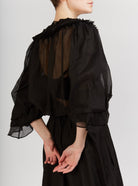 Back view of Roussia Black Blouse by Thierry Colson