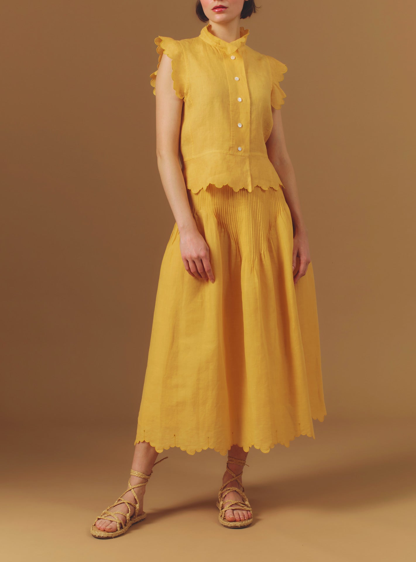 Front view of Verde Barocco Scallops Sunflower Skirt with Yael Vest by Thierry Colson
