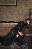 Louise wearing a Phoebe black dress from pre spring 2024 by Thierry Colson, photographed by Jamie Beck
