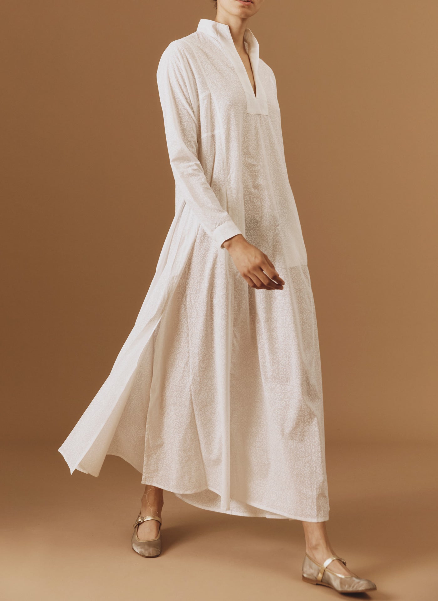 Side view of Parvati white on white long Kaftan by Thierry Colson