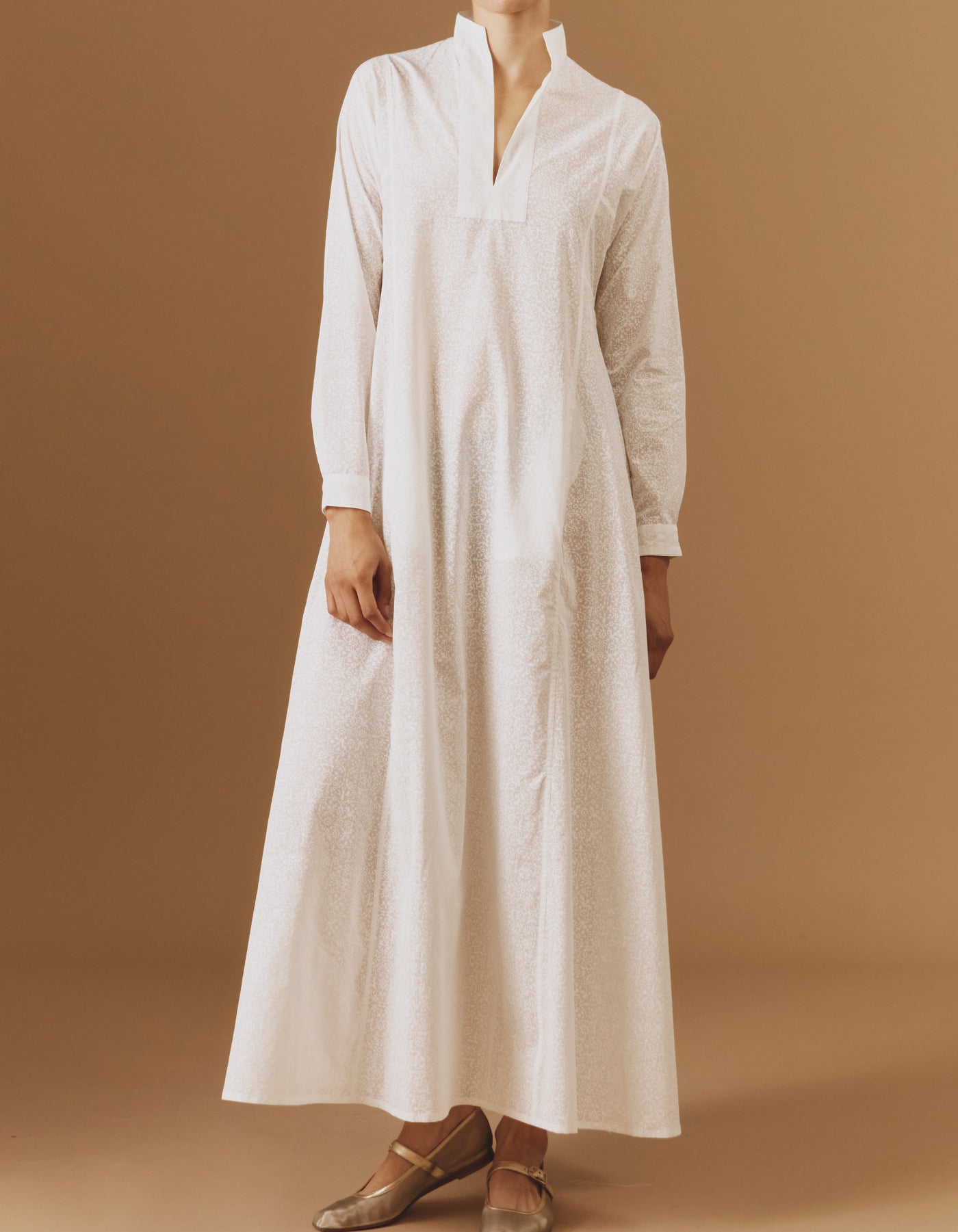 Front view of Parvati white on white long Kaftan by Thierry Colson