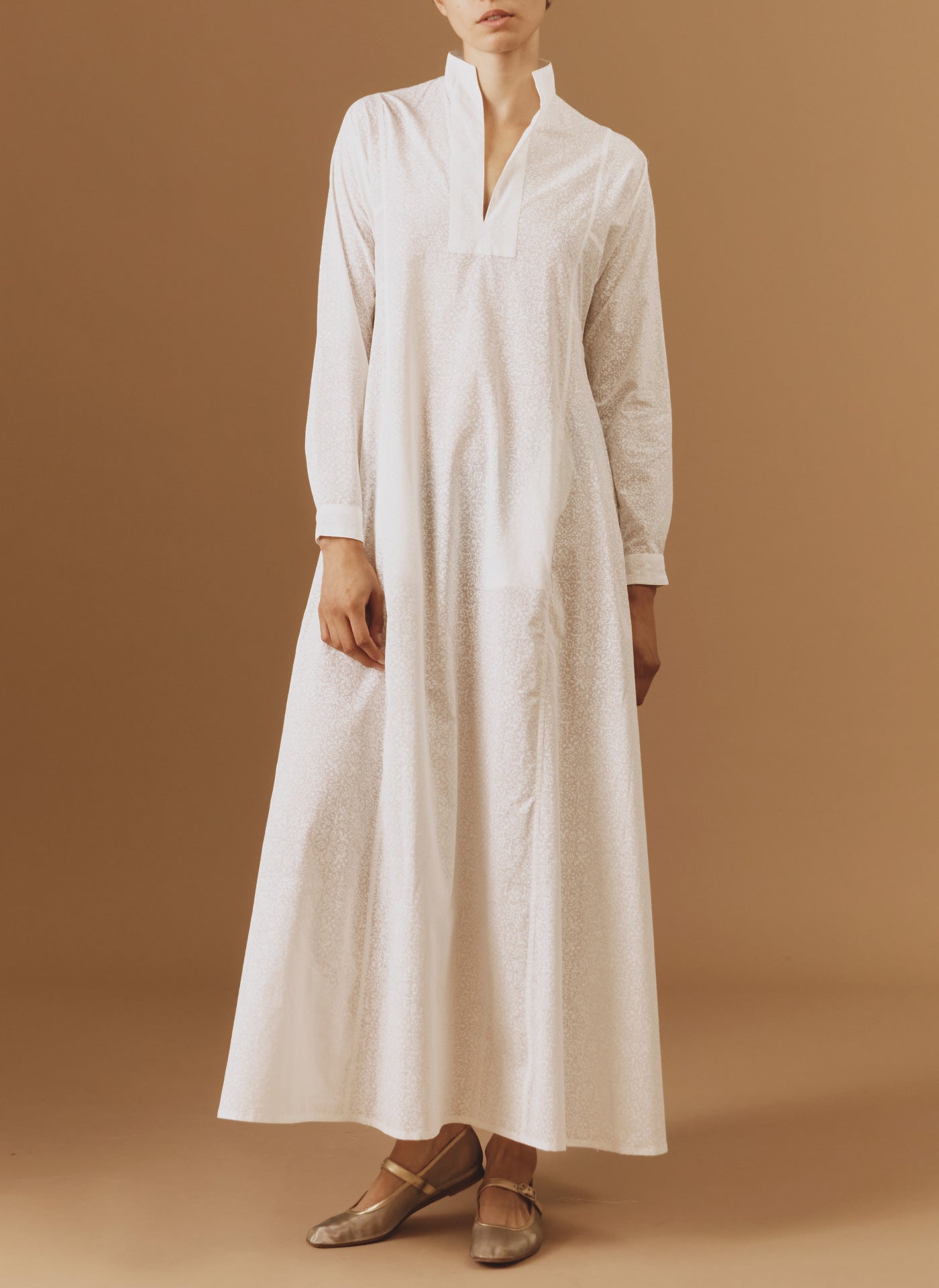 Front view of Parvati white on white long Kaftan by Thierry Colson