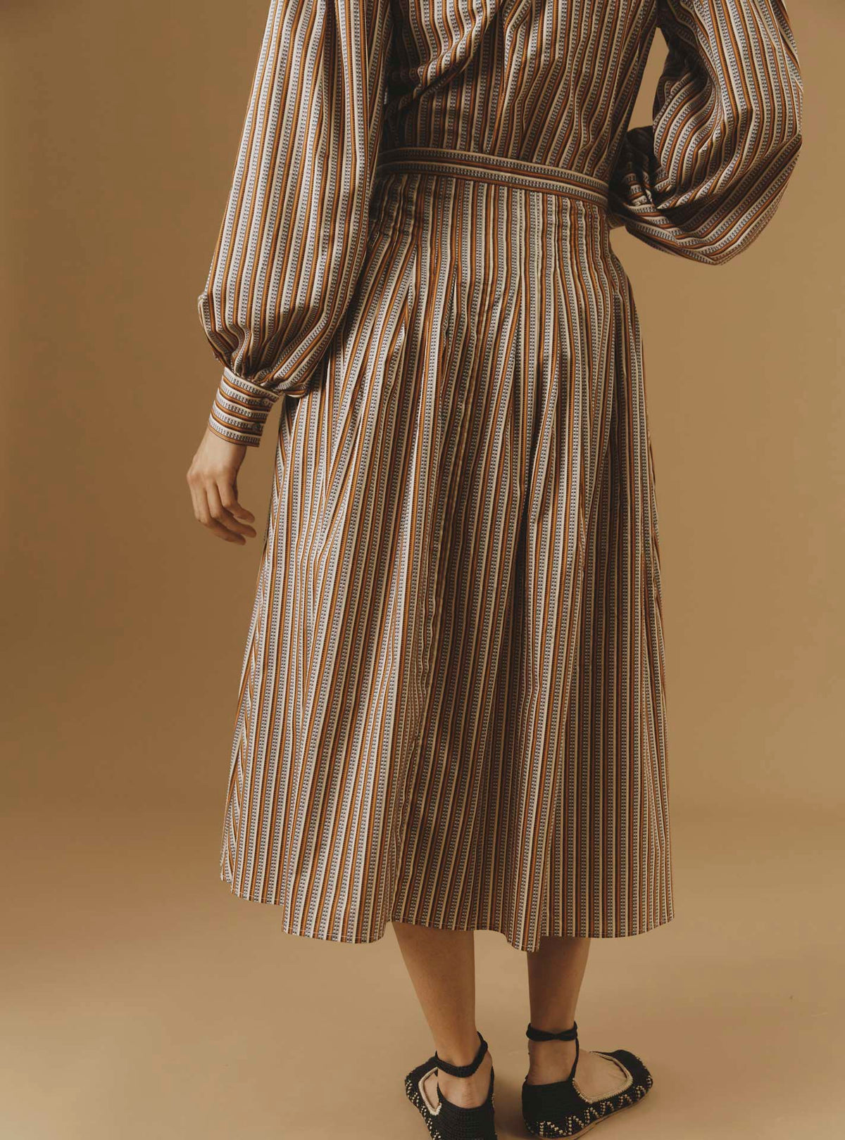 Back view of Zazou copper Cotton Skirt by Thierry Colson