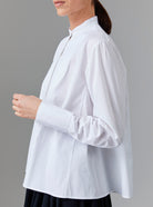 Side view of Ali Shirt - Off White Poplin Topstitching by Thierry Colson