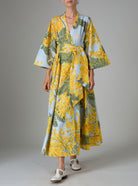 Front view of Almudena kaftan kimono dress in yellow and storm blue mimosa-inspired Garden of Eden print. Thierry Colson PS25