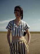 Front view - Model wearing Bianca Vest with Loulou trousers in Tobacco stripes.