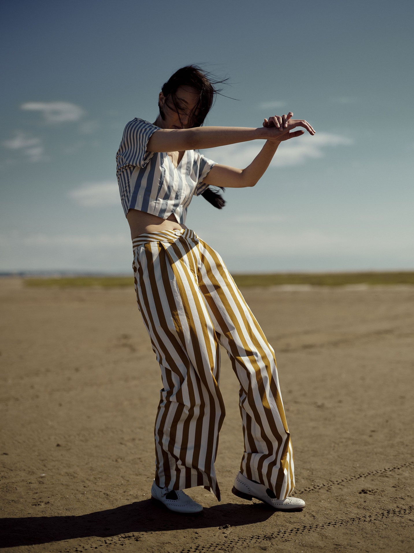 Model wearing tailored cotton pants: Loulou Trousers by Thierry Colson