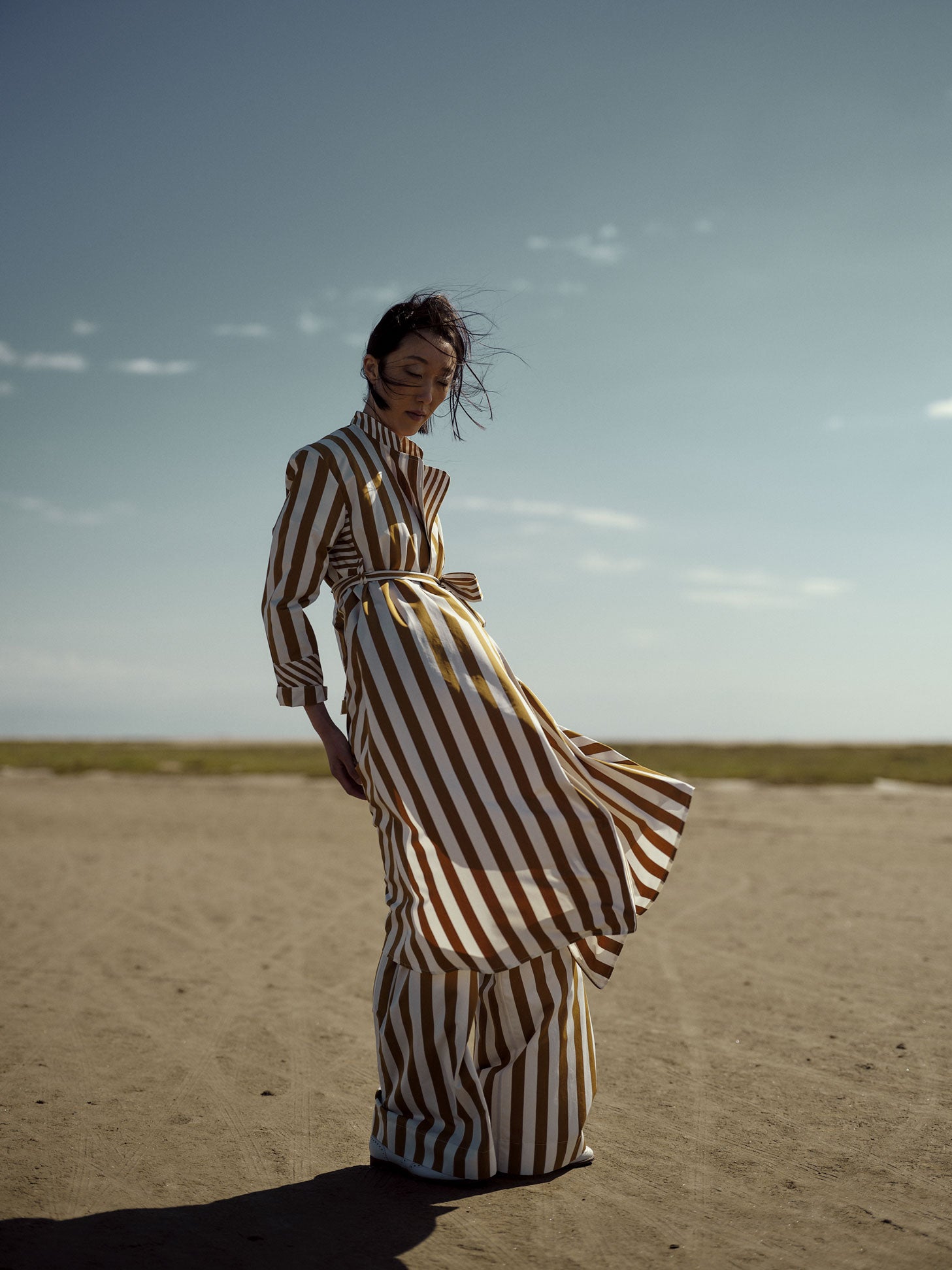 Model wearing Versatile robe dress styled as a lightweight summer coat.