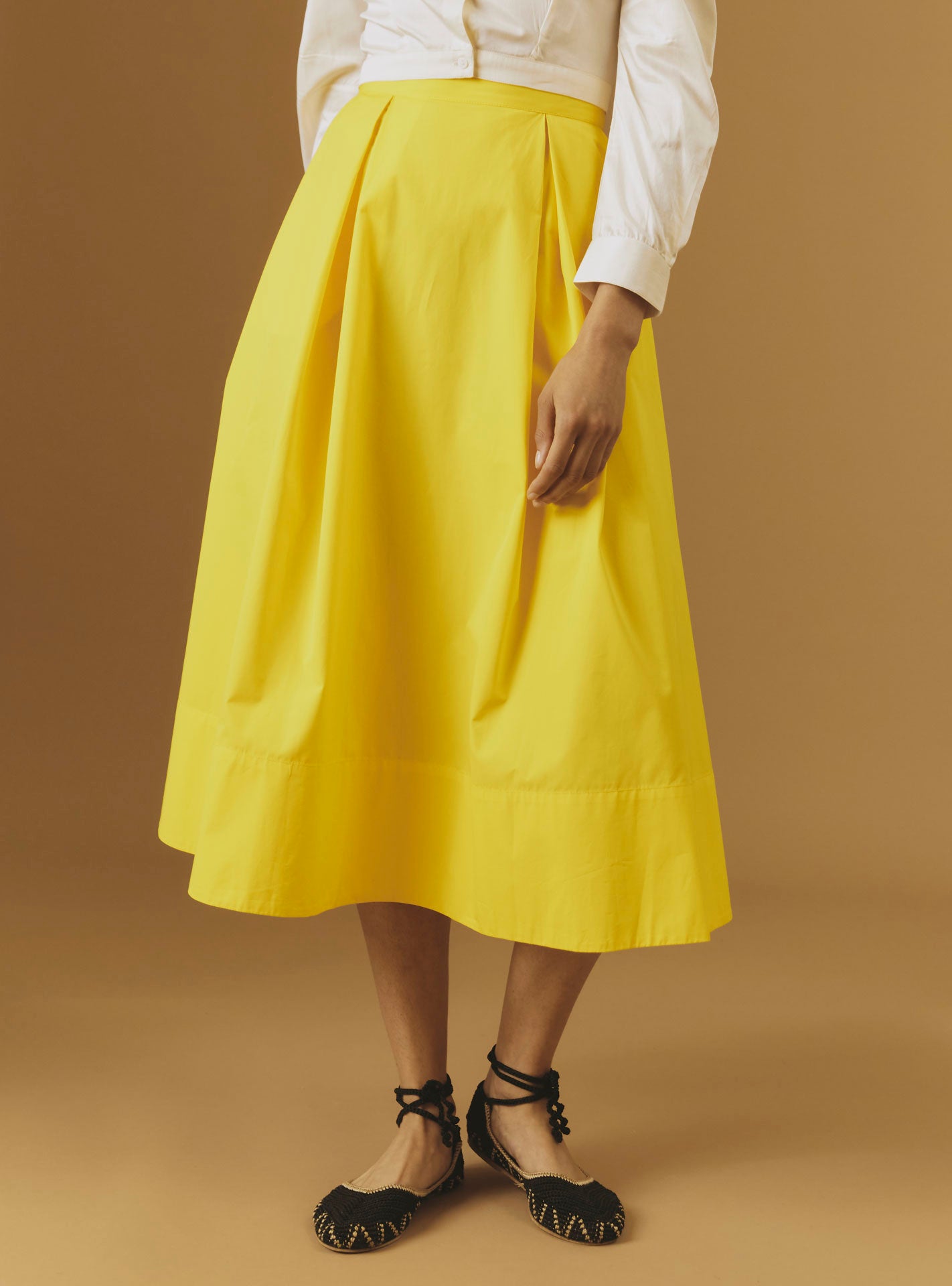 Front view of Wynona yellow cotton skirt by Thierry Colson