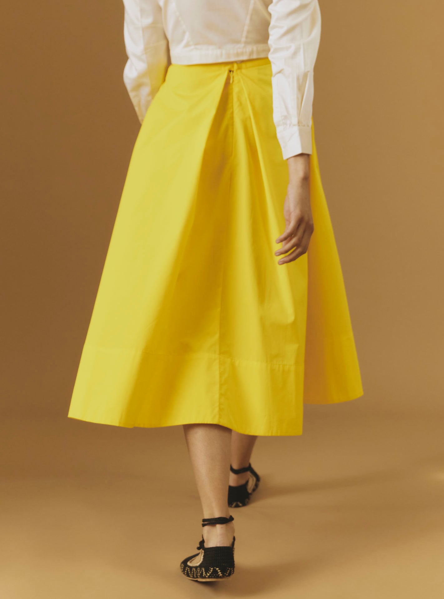 Back view of Wynona yellow cotton skirt by Thierry Colson