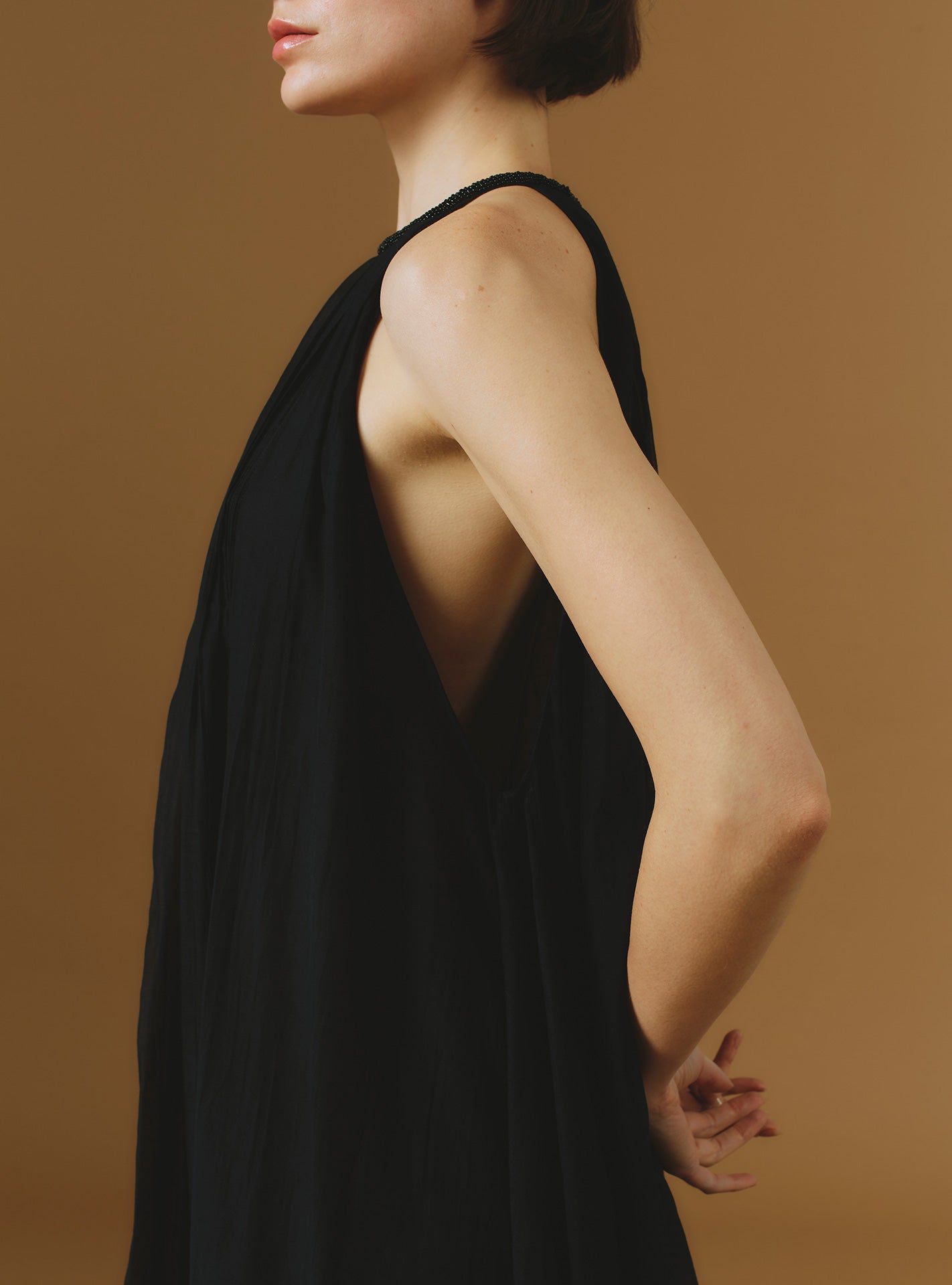 Side detail view of Zenith Chanderi Appliqué Black Long Dress by Thierry Colson